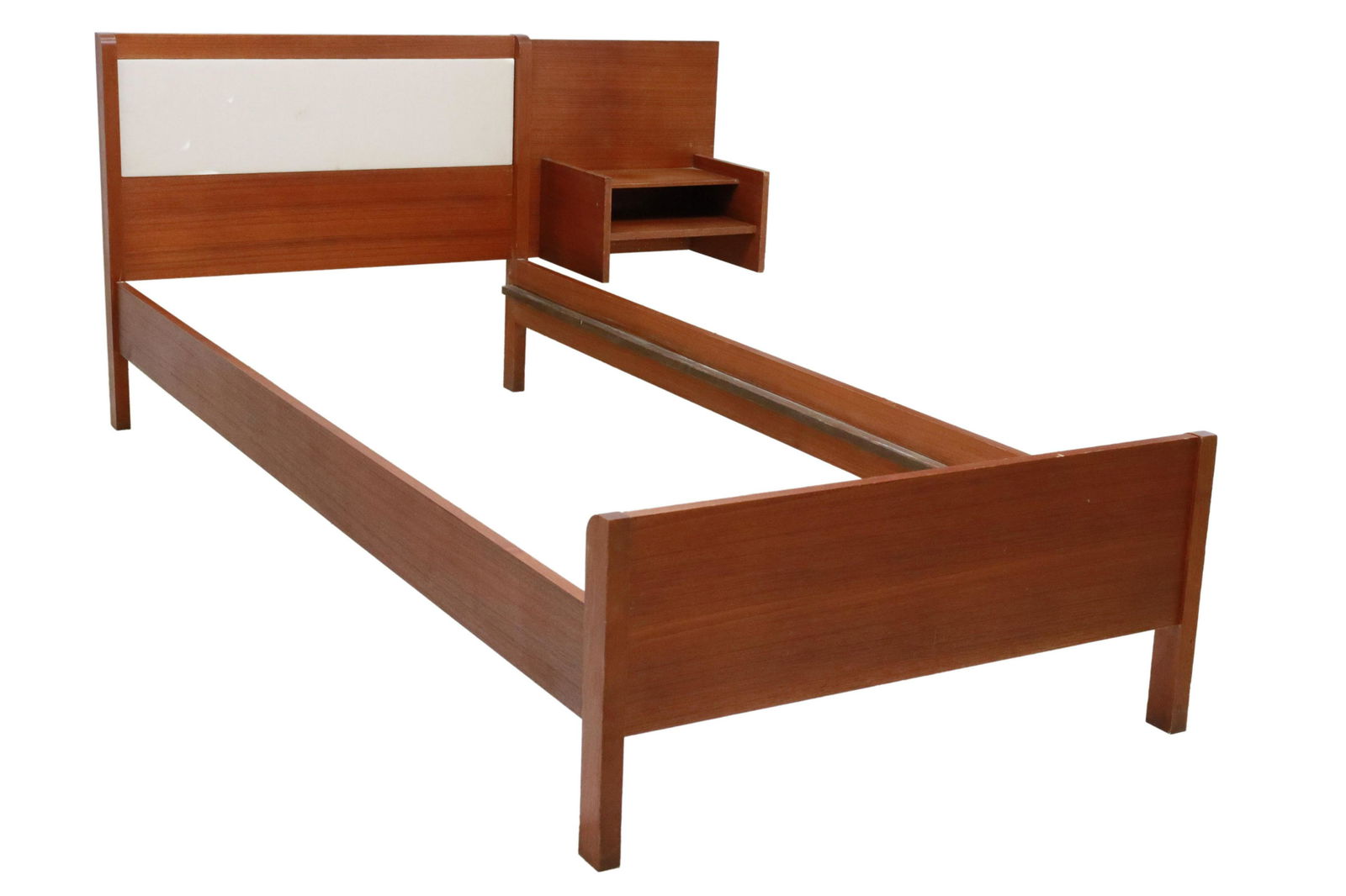 ITALIAN MID-CENTURY MODERN TEAK BED & NIGHTSTAND: Italian mid-century modern teak bed and nightstand, c.1950s, inset fabric panel to headboard, rising on block legs, attached nightstand, having two medial shelves, can be switched to either side, bed