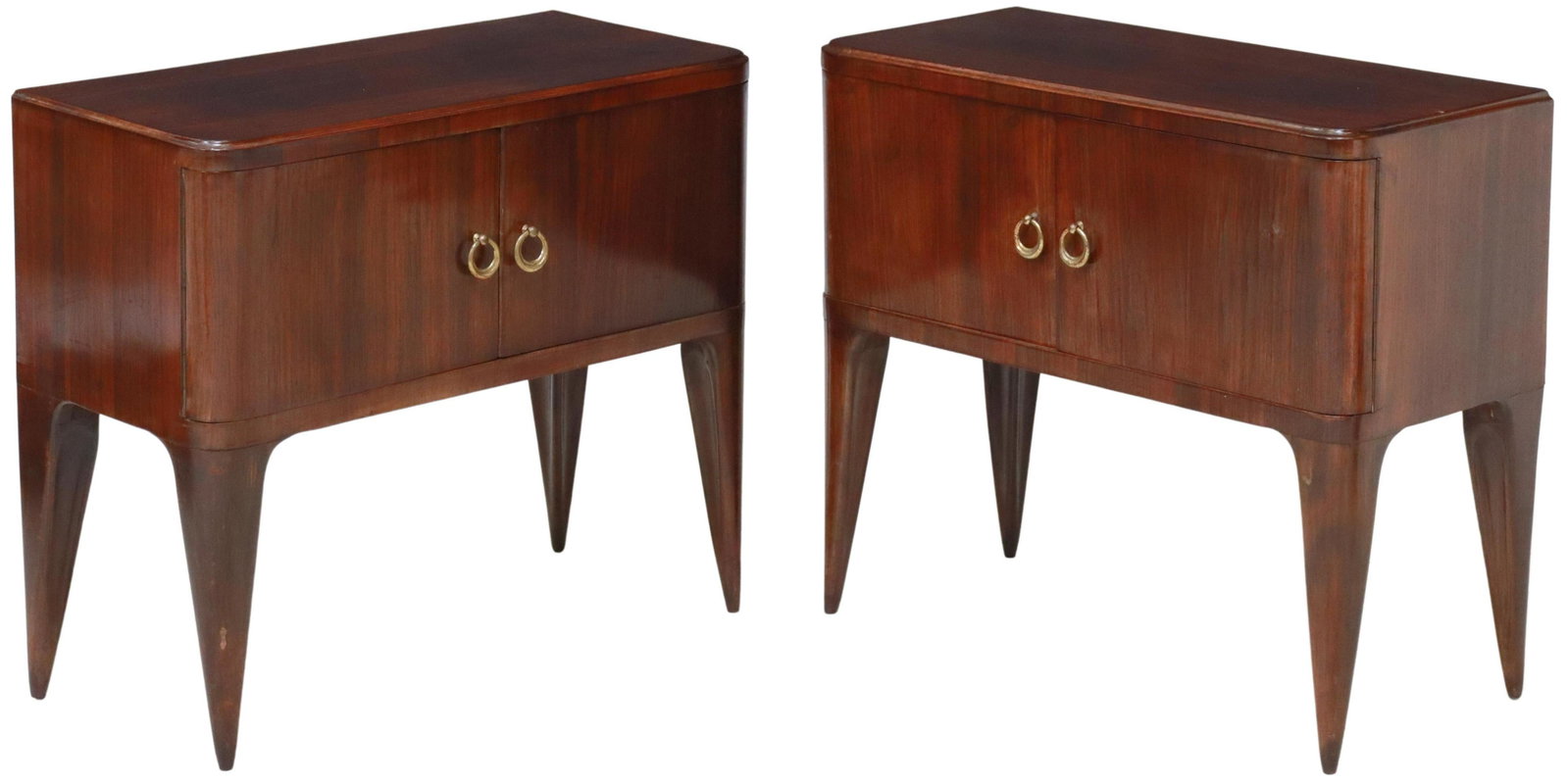 2) ITALIAN MID-CENTURY MODERN ROSEWOOD NIGHTSTANDS: (pair) Italian mid-century modern rosewood bedside cabinets, c.1950s, having rounded rectangular top, over dual cabinet doors, open interior, rising on tapered legs, some lifting to veneer, approx 22"