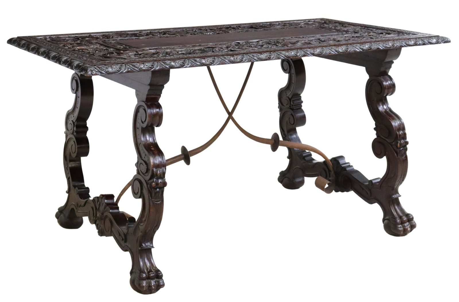 EXCEPTIONAL RENAISSANCE REVIVAL CARVED TABLE,SPAIN: Spanish Renaissance Revival table, 19th c., the top intricately carved with figures and foliates, over lunette border, rising on scrolling ox yoke supports, joined with iron cross stretcher, ending on