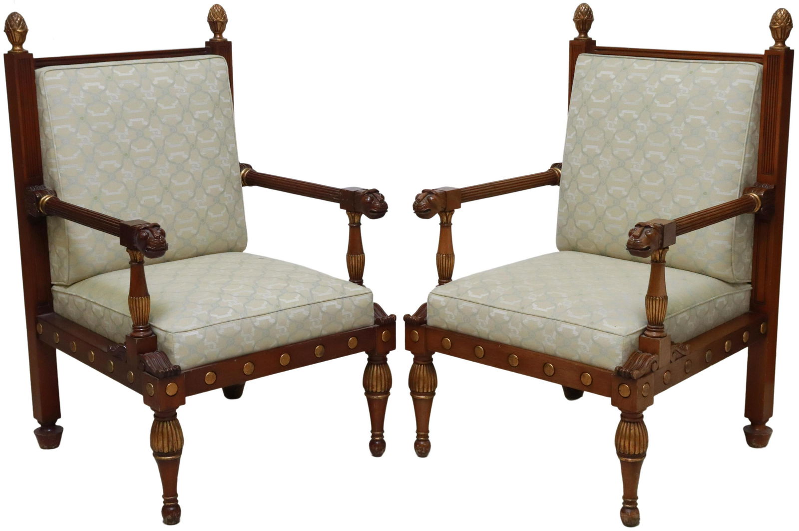 2) SMITH & WATSON REGENCY STYLE MAHOGANY ARMCHAIRS: (pair) Regency style parcel gilt mahogany armchairs, Smith & Watson, New York, 20th c., having artichoke finials, back and seat in patterned upholstery, fluted arms, terminating in animal mask handhol