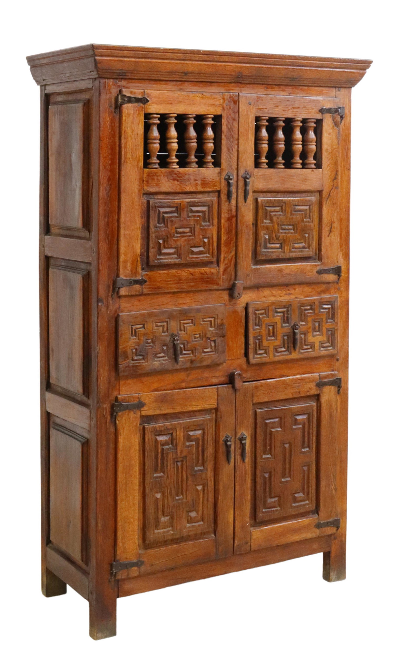 SPANISH BAROQUE CARVED CUPBOARD CABINET, 18TH C.: Spanish Baroque carved cupboard cabinet, 18th c., case with mortise and tenon joined, having molded cornice, dual spindled cabinet doors, fitted with two drawers, over two lower cabinet doors, rising 