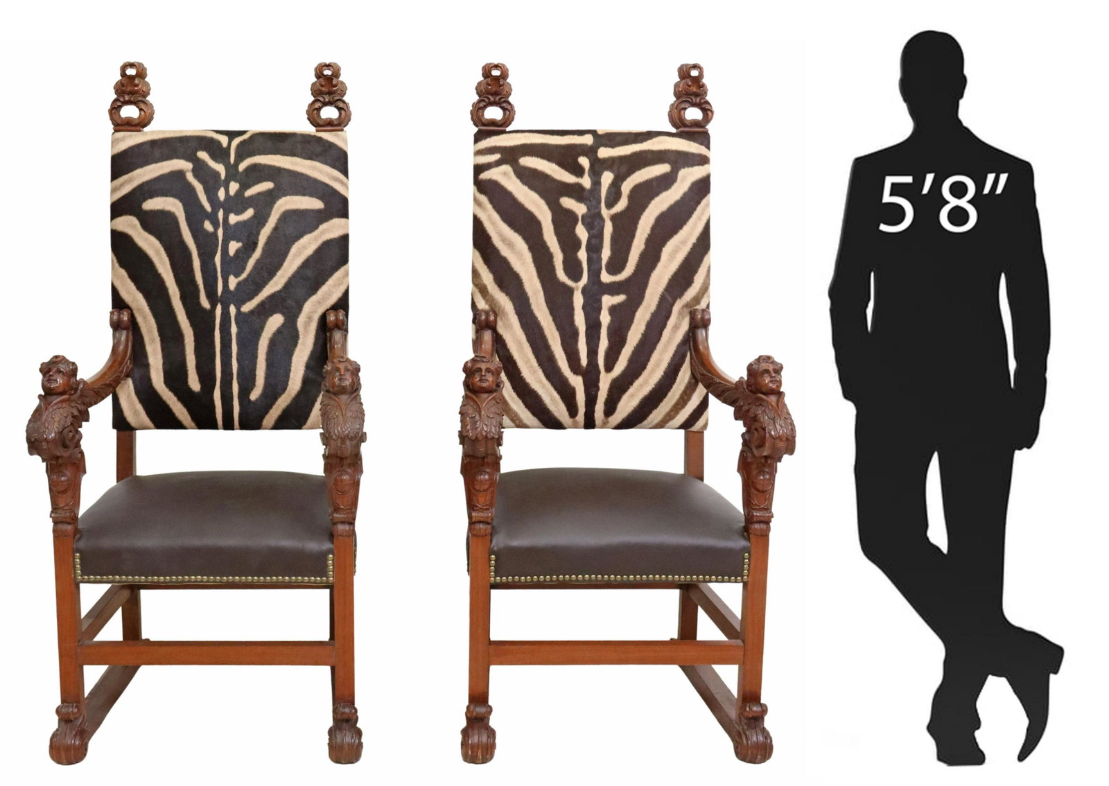 (2) ITALIAN RENAISSANCE REVIVAL ZEBRA ARMCHAIRS: (pair) Italian Renaissance Revival armchairs, in later zebra hide and leather upholstery, having foliate tiered finials, upholstery with nailhead trim, carved winged cherub handholds, rising on block 
