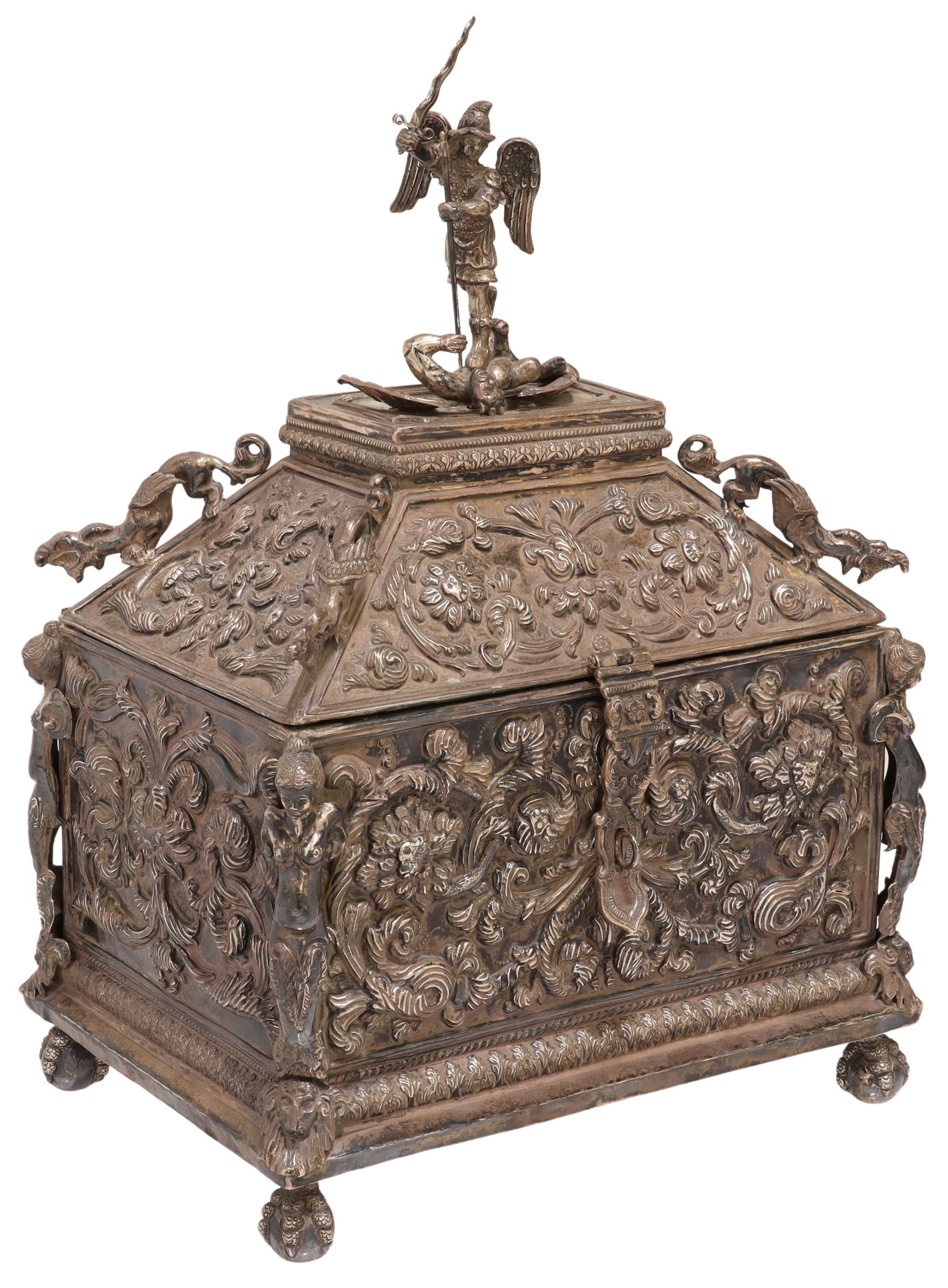 BAROQUE STYLE STERLING SILVER VALUABLES CASKET: Baroque style sterling silver valuables casket, Bolivian Cenart (Ismael Mora), 20th c., cast finial modeled as Saint Michael vanquishing Satan, repousse case with foliate scrolls, grotesques and femal