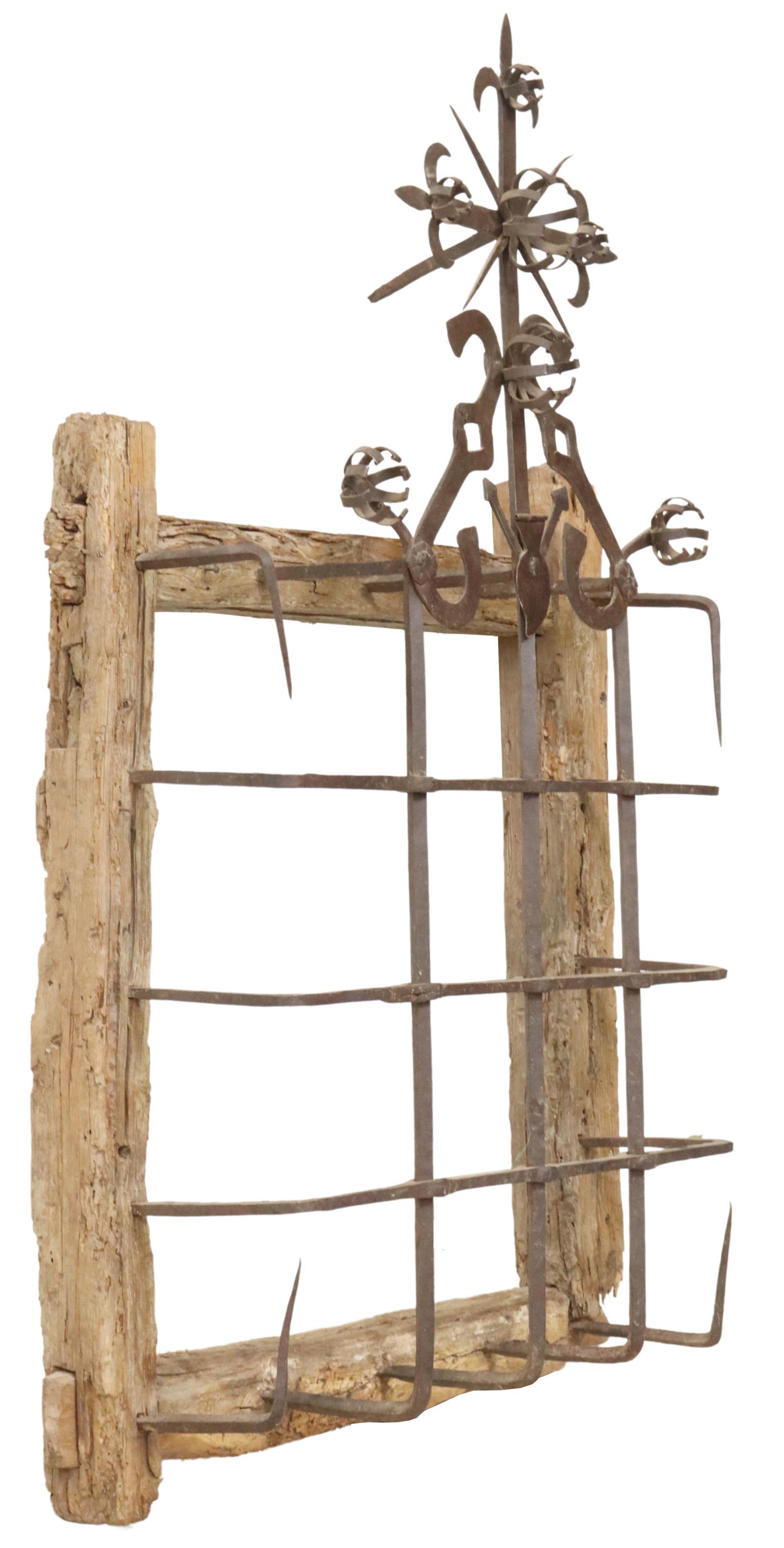 ANTIQUE IRON & WOOD FRAME WINDOW, SPAIN: Antique iron window, Spain, mortise and tenon wood frame, with protruding iron lattice bars, ornamented with floral accents, approx 53.5"h, 33"w, 12"d Start Price: $200.00