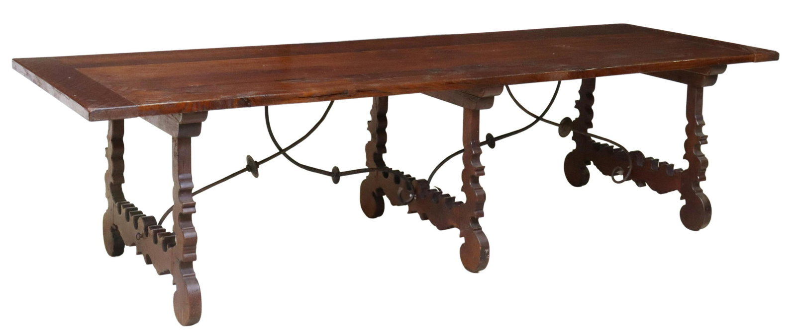LARGE SPANISH BAROQUE STYLE OAK TABLE, 118.25"L: Large Spanish Baroque style oak table, 19th c., plank top with breadboard ends, rising on ox yoke supports, joined with two iron cross stretchers, approx 31"h, 118.25"l, 39"w Start Price: $800.00