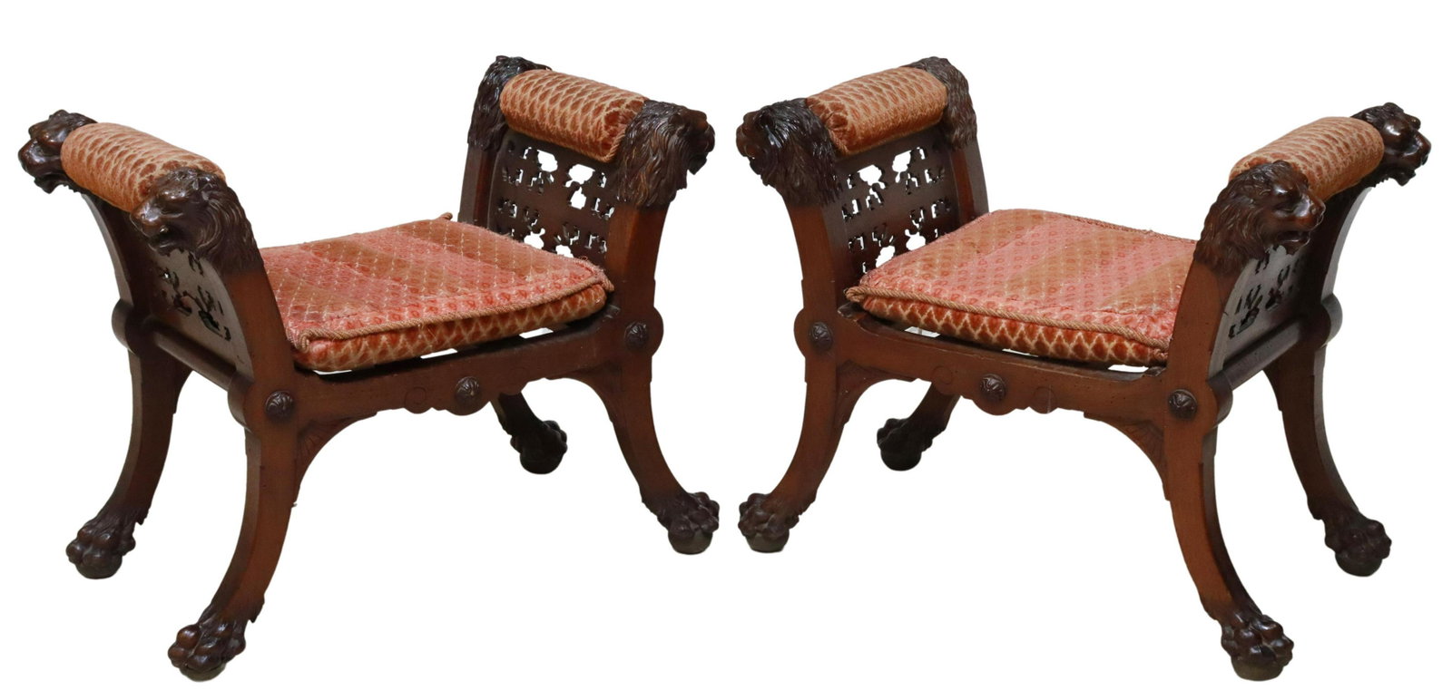(2) SPANISH RENAISSANCE REVIVAL LION'S HEAD STOOLS: (pair) Spanish Renaissance Revival stools, 19th/ 20th c., having padded arm rails, with carved lion mask terminals, openwork side panels, removable seat cushions rising on lions paw and ball feet, app
