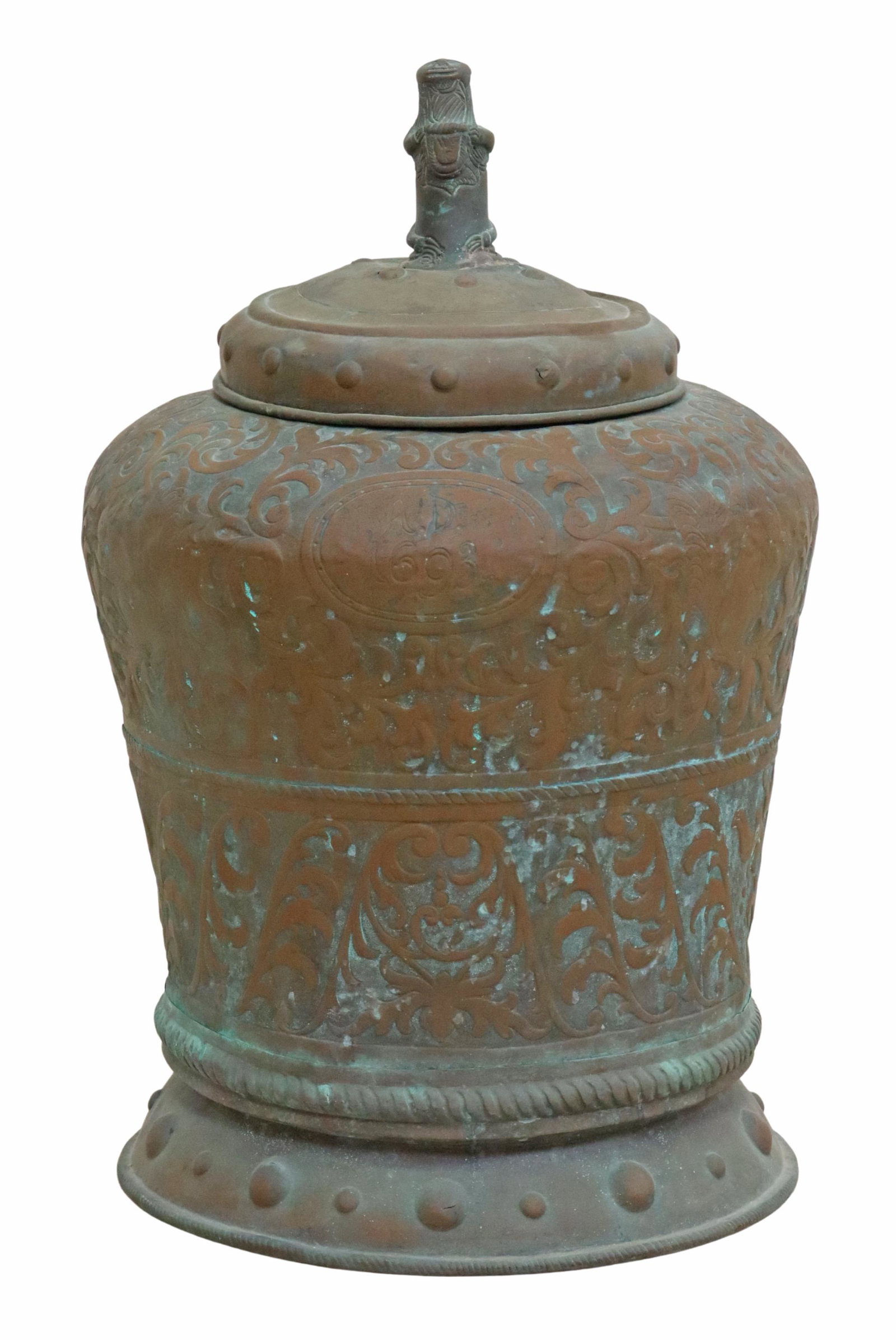 LARGE SPANISH BAROQUE STYLE COPPER LIDDED URN 29"H: Spanish Baroque style copper storage container/ lidded urn, figural finial holding monogrammed shield "W.S.K.", over bell-form urn, ornamented in repousse foliates, cartouche to one side monogrammed T