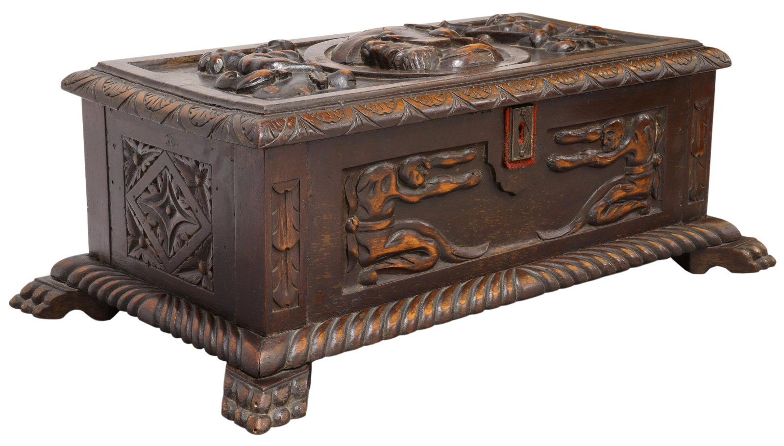 SPAIN RENAISSANCE REVIVAL FIGURAL CARVED TABLE BOX: Renaissance Revival carved table box, Spain, early 20th c., central profile portrait rondelle, flanked by trumpeting figures, lunette carved edge on the hinged top, open interior, over base with folia