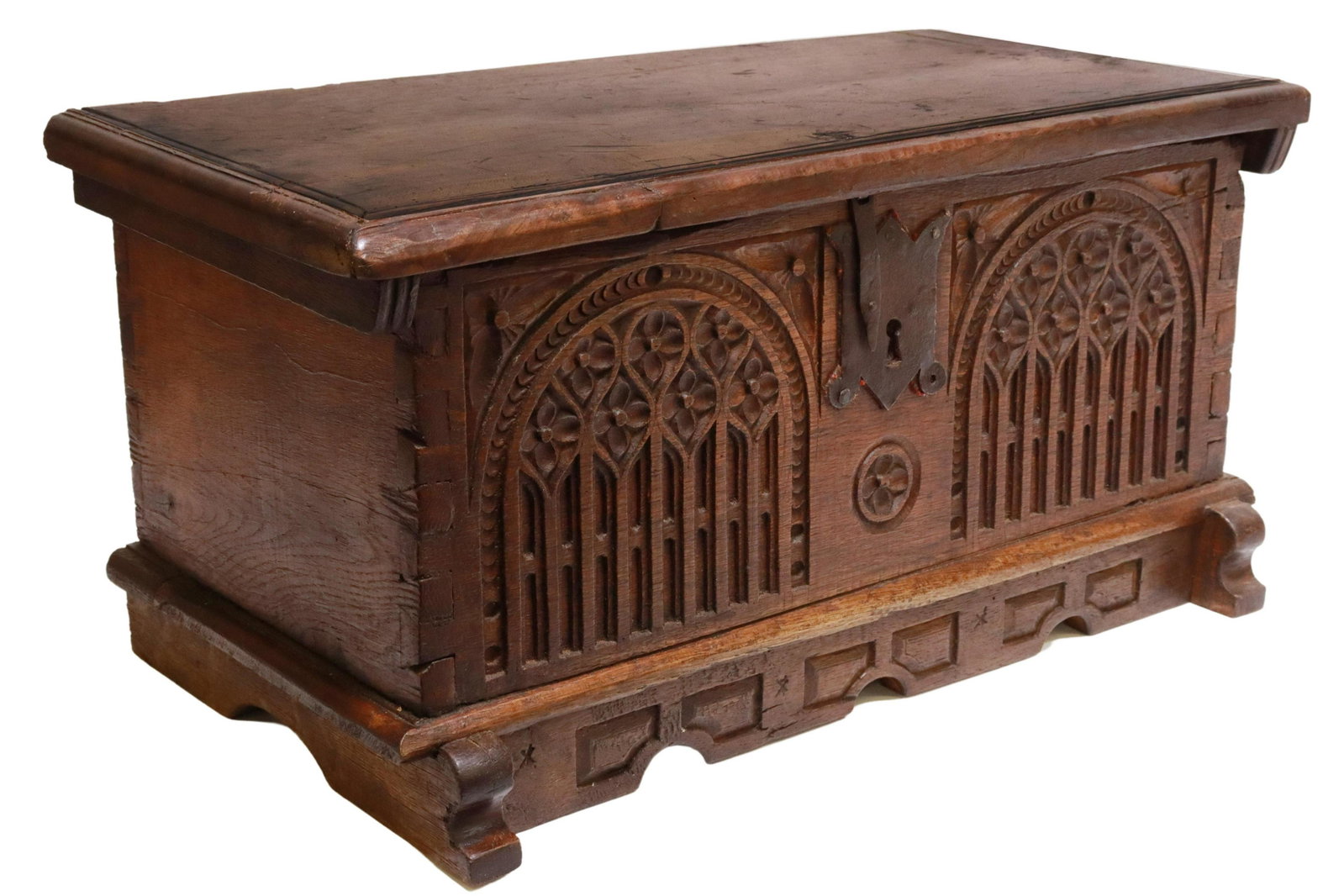 GOTHIC REVIVAL CARVED COFFER BOX, 19TH C.: Gothic Revival carved coffer box, 19th c., rectangular case with dovetail construction, lid on iron strap hinges, front panel carved with tracery, open interior, approx 12.5"h, 25"w, 13"d Start Price: