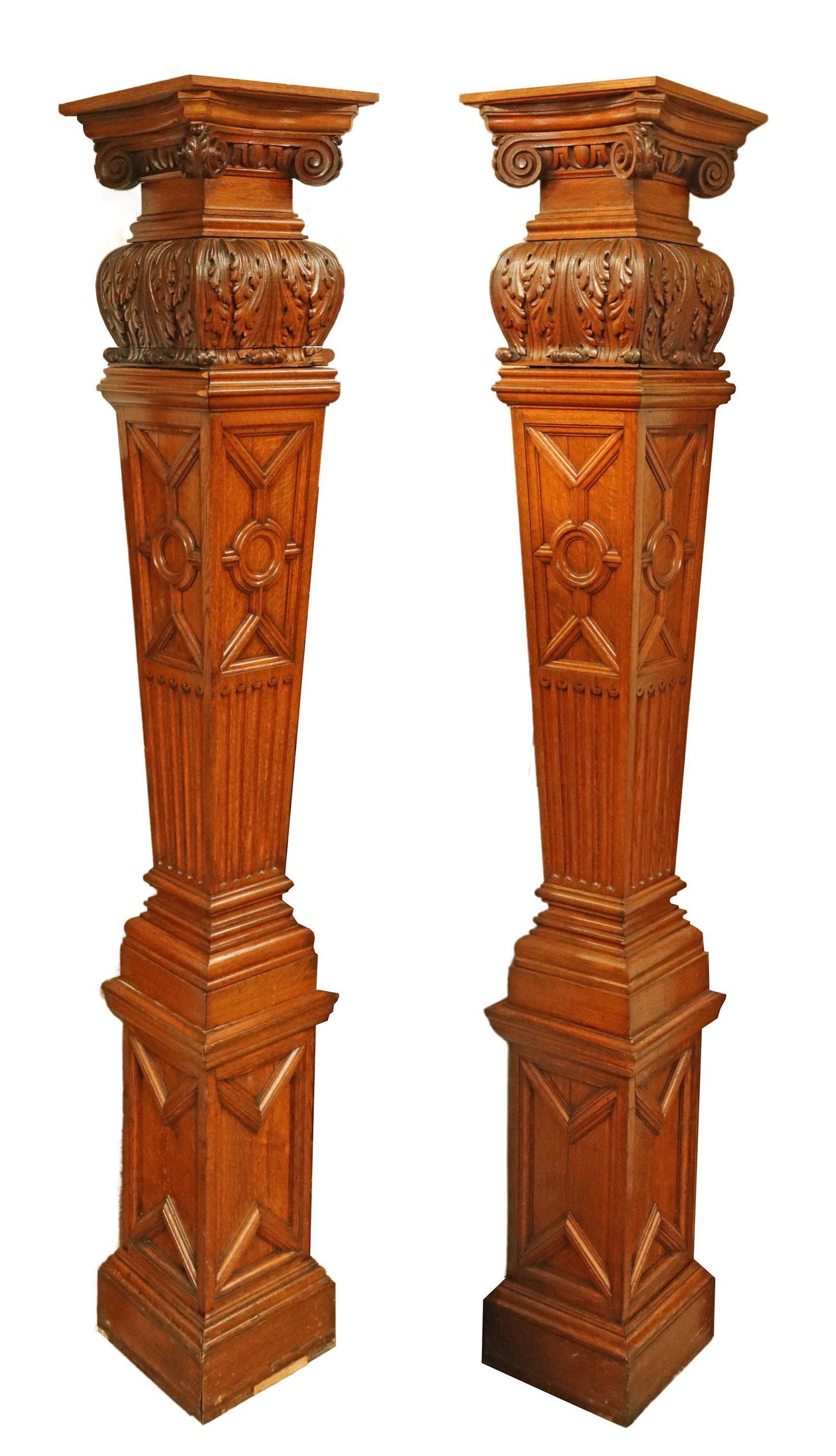 (2) CONTINENTAL OAK ARCHITECTURAL COLUMNS, 96"H: (pair) Continental oak architectural elements/ columns, 19th/ 20th c., half-form for corner mount, unfinished to the back, having scrolled volutes, over carved acanthus, rising on tapered and paneled 