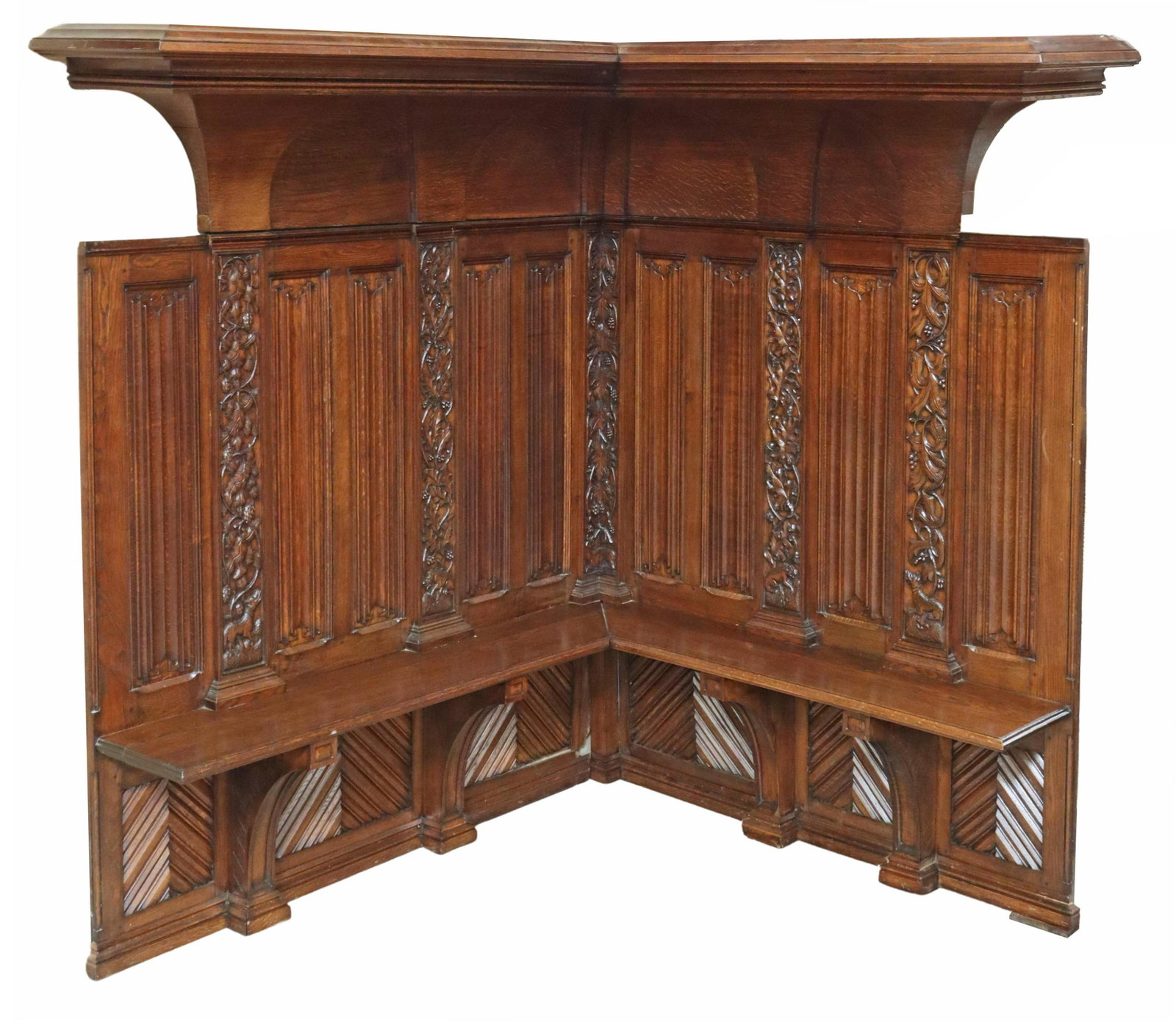 FRENCH ARCHITECTURAL OAK CLERIC'S CORNER BENCH: French architectural oak cleric's corner bench with wall paneling, 19th c., molded cornice, over back paneling carved with linenfold and interspersed dog and foliate panels, corner bench seat, rising 