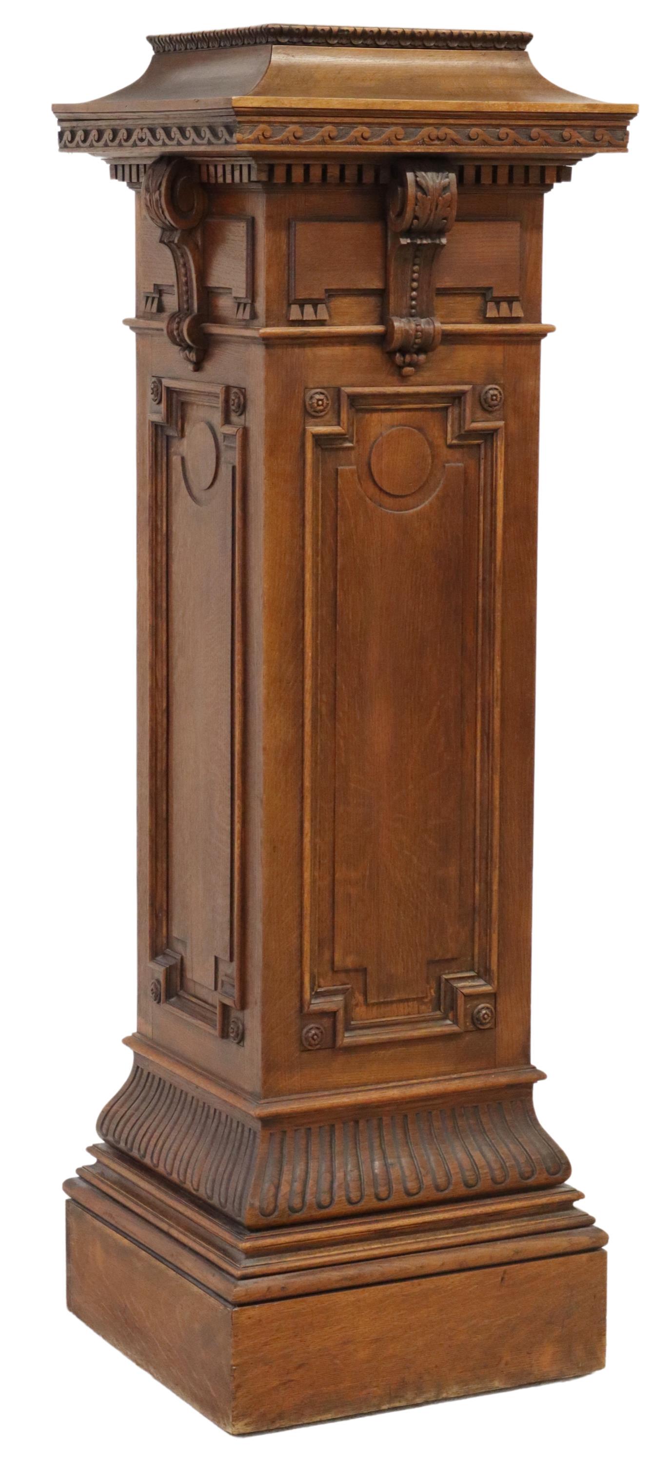 AMERICAN CARVED OAK PEDESTAL STAND, 66.25"H: American carved oak pedestal stand, late 19th/ early 20th c., molded cornice top, dentil trim, over acanthus scrolled accents, paneled sides, rising on stepped square base, approx 66.25"h, 21"w, 21"d 