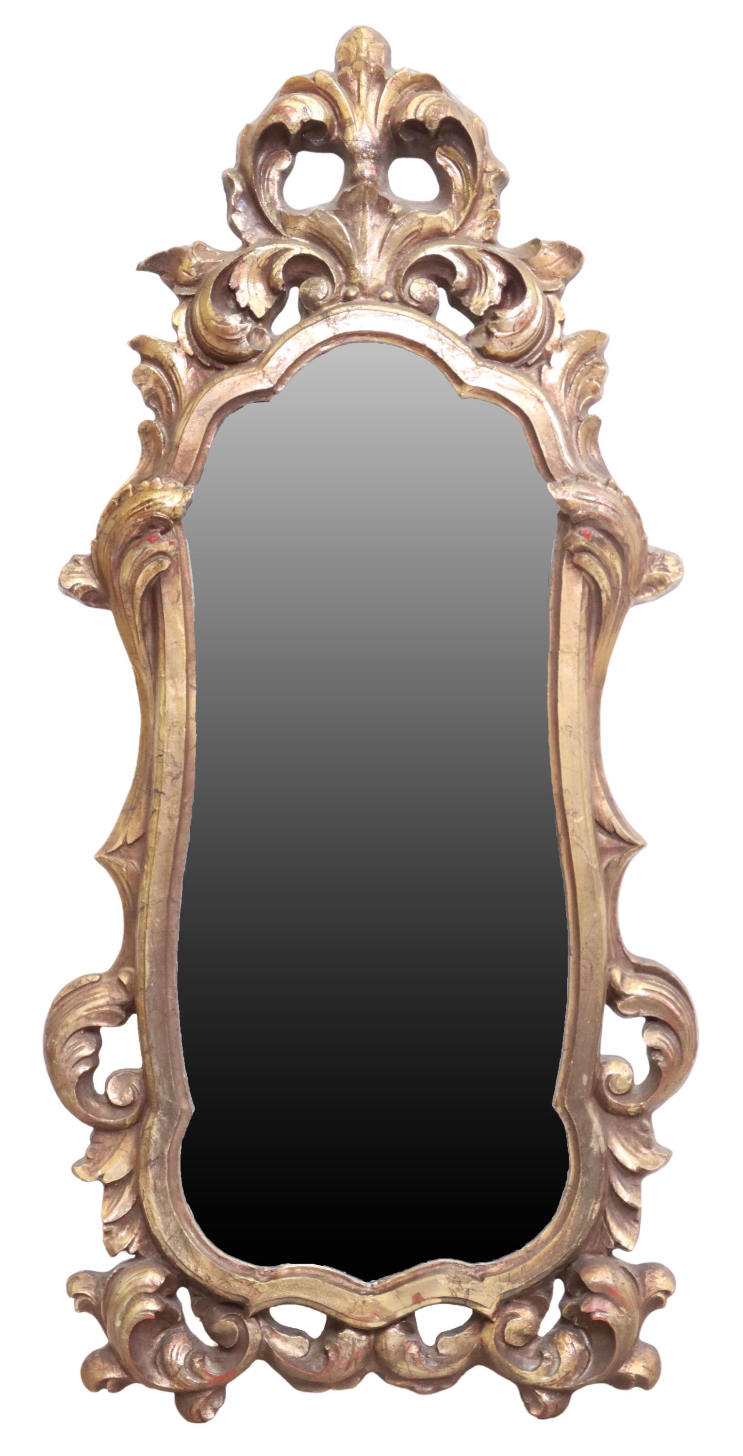 LOUIS XV STYLE GILT WALL MIRROR: Louis XV style gilt wall mirror, 20th c., having large foliate crest, over shaped frame, encasing flat mirror plate, approx 53"h, 24.5"w, 20lbs Start Price: $100.00
