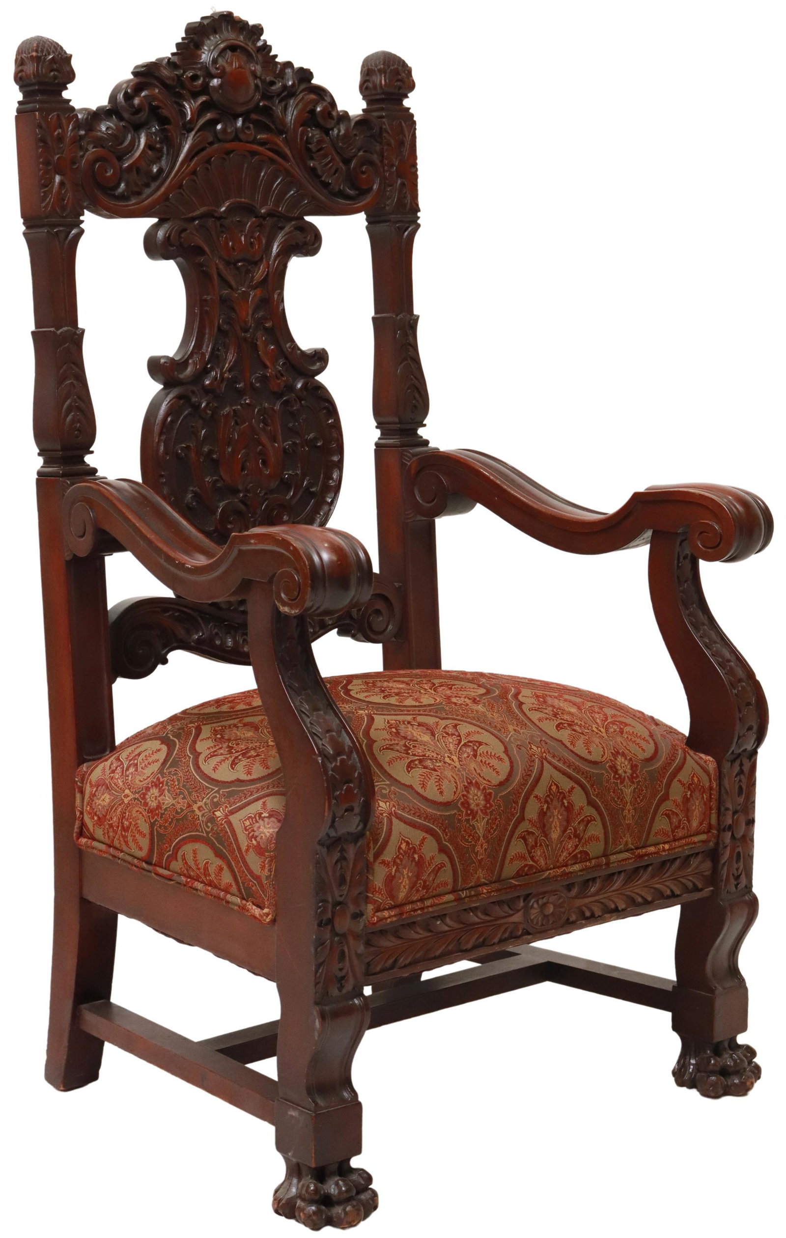 OVERSIZED BAROQUE STYLE CARVED ARMCHAIR: Oversized Baroque style armchair, 20th c., in a mahogany finish, crest and vasiform splat carved with foliate scrolls, volute arms, upholstered seat, rising on stretcher-joined legs, ending in front p
