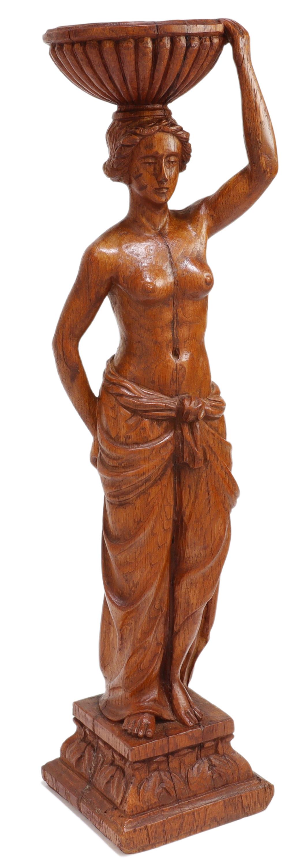 NEOCLASSICAL DRAPED WOMAN CANDLE HOLDER: Neoclassical carved wood candle holder, 19th/ 20th c., melon ribbed bobeche, held aloft by classical semi-nude female in drapery, rising on acanthus pedestal base, approx 23.75"h, 6.5"w, 5.5"d, 6lbs S