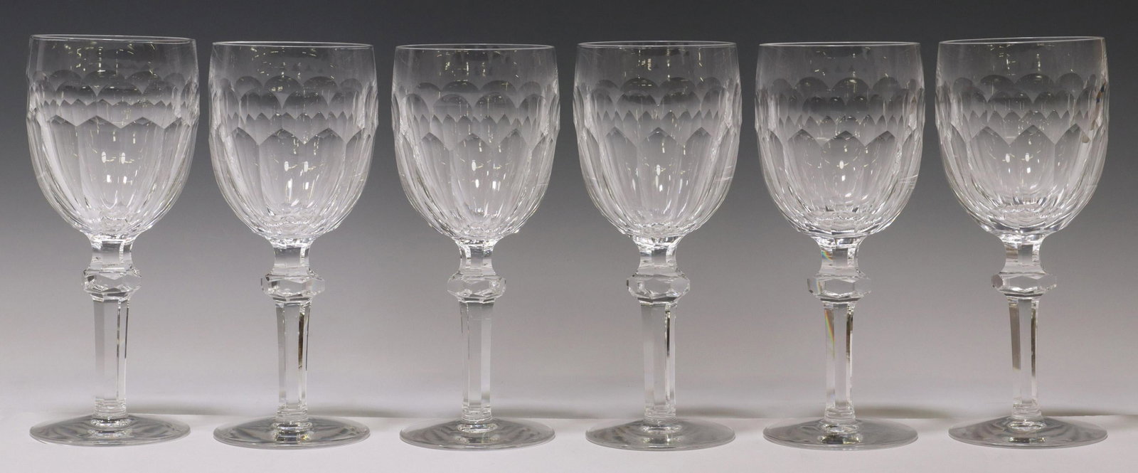 (6) WATERFORD CURRAGHMORE CRYSTAL WATER GOBLETS: (lot of 6) Waterford cut crystal water goblets, in the "Curraghmore" pattern, paneled bowl, on a knopped stem, acid-etched mark, (one) with small chip to rim, (one) with bubble at side of bowl, approx