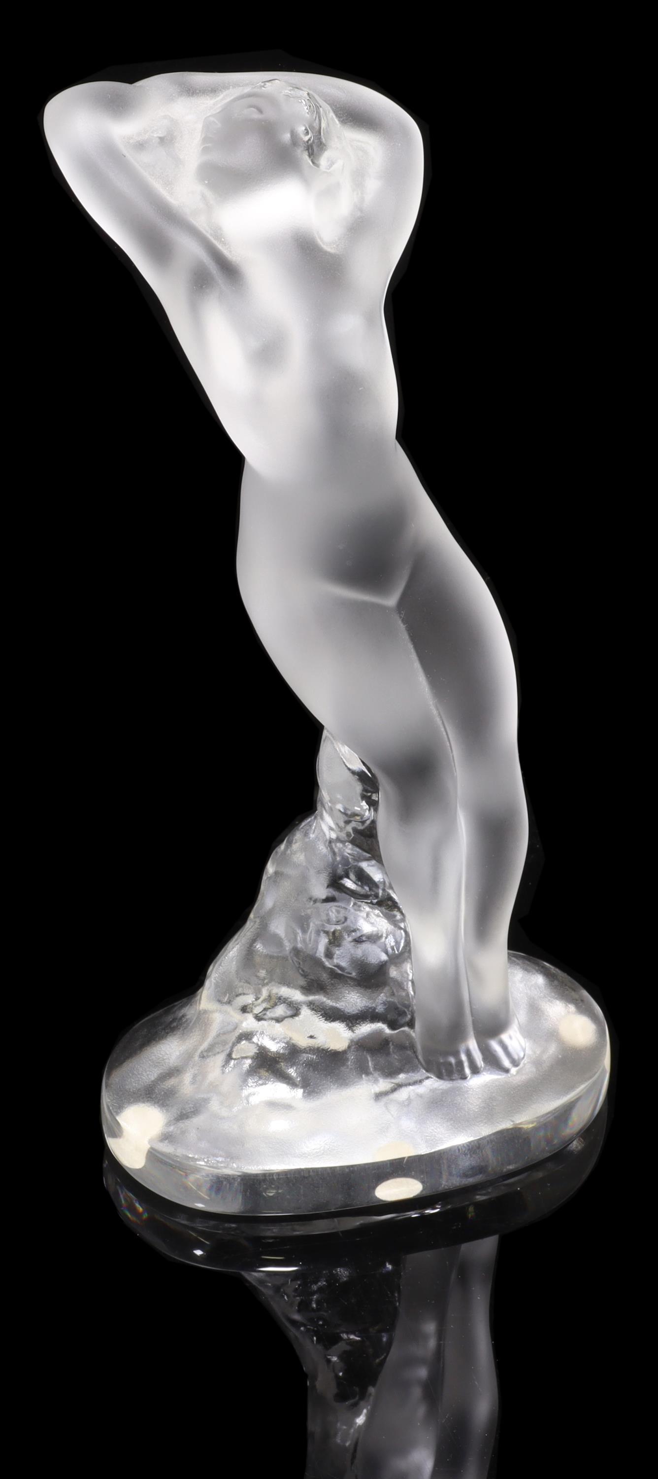 FRENCH LALIQUE ART GLASS 'DANSEUSE BRAS LEVES': French Lalique art glass figure, "Danseuse Bras Leves" (Dancer Arms Raised), designed by Marc Lalique (French, 1900-1977), engraved signature Lalique France, retaining retail sticker, original fitted 