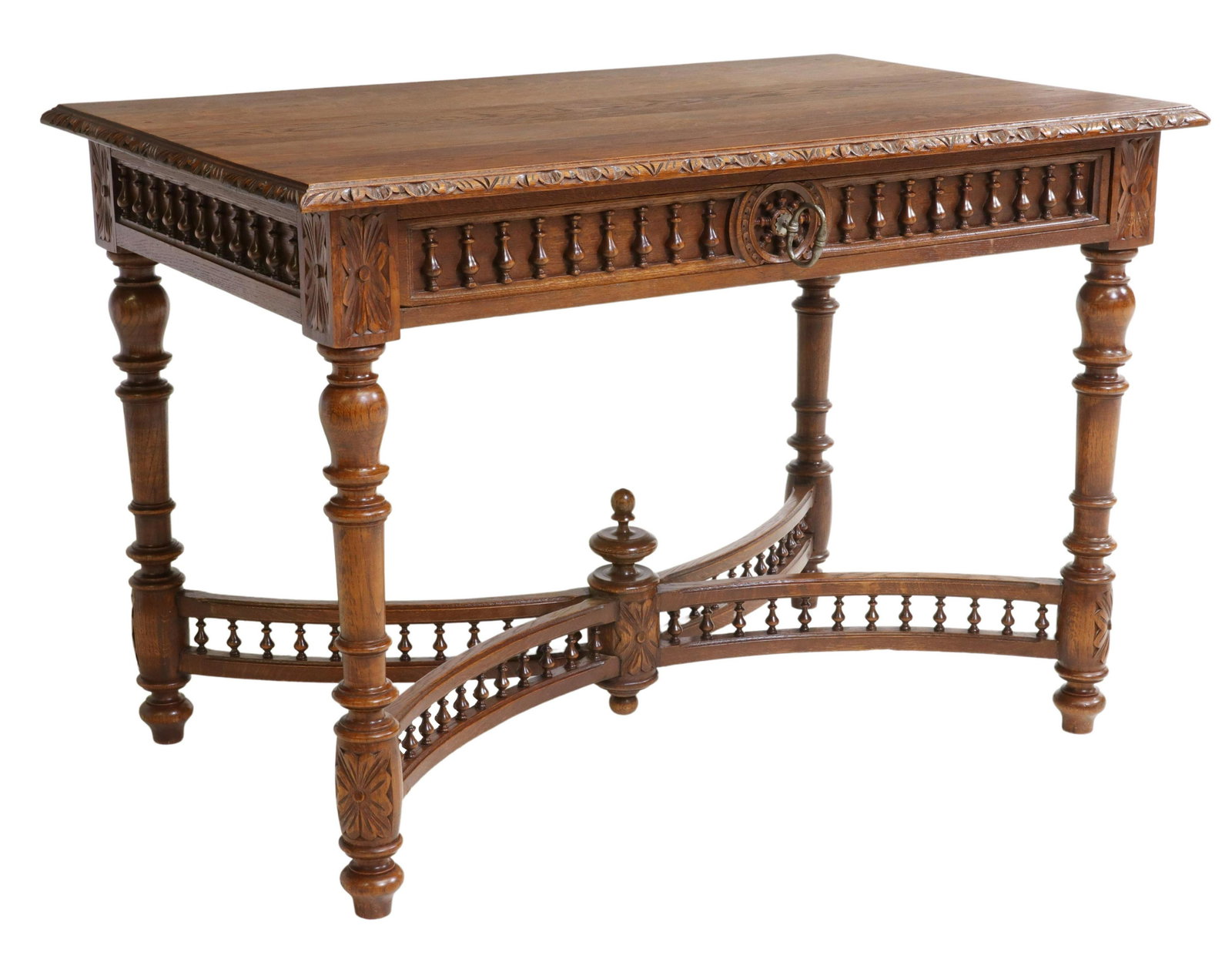 FRENCH BRETON CARVED OAK SPINDLED WRITING DESK: French carved oak writing desk, Brittany, late 19th c., rectangular top with carved foliate border, fitted with single drawer, rising on turned legs, joined by x-form cross stretcher with spindled col
