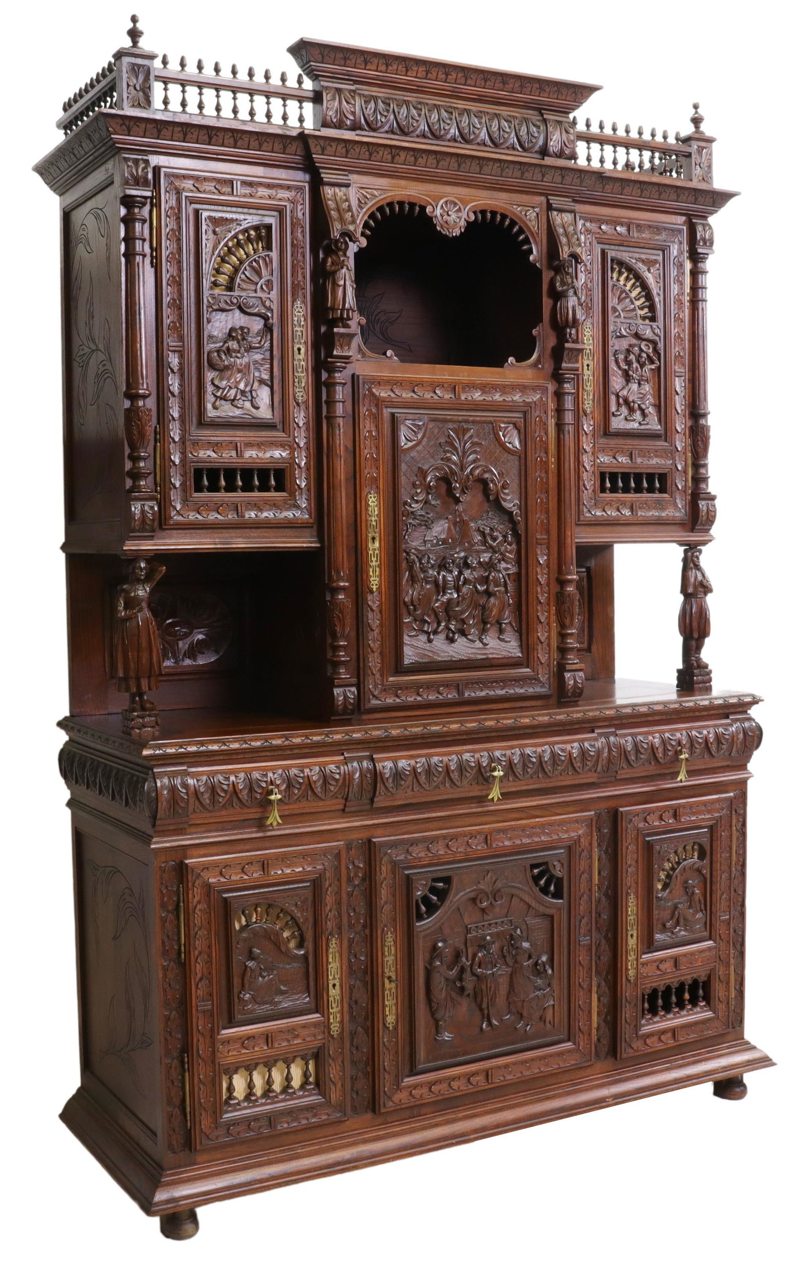 FRENCH BRETON FIGURAL CARVED SIDEBOARD, 19TH C.: French carved oak sideboard, Brittany, late 19th c., accented with columns, spindles, figural carved peasant scenes, incised carving, the upper cabinet with an open display area over a central drawer 