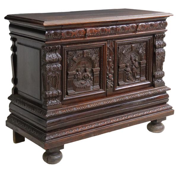 FRENCH CARVED OAK FIGURAL RELIGIOUS SIDEBOARD: French carved figural sideboard, late 19th c., having stepped rectangular top, over two drawers, above two paneled cabinet doors, carved with scenes of the Birth of Christ and the Annunciation of Mary
