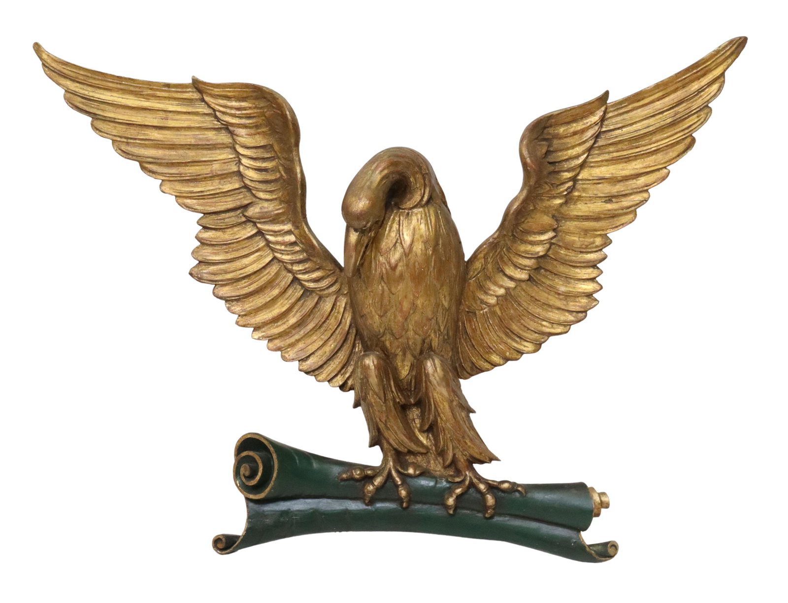 ARCHITECTURAL CARVED GILTWOOD EAGLE, 29" X 39": Carved giltwood eagle, modeled with open wings, grasping a scroll in his talons, approx 29"h, 39"w, 7.5"d, 7.25lbs **Provenance: consignor states removed from the penthouse above the Majestic Theatre 