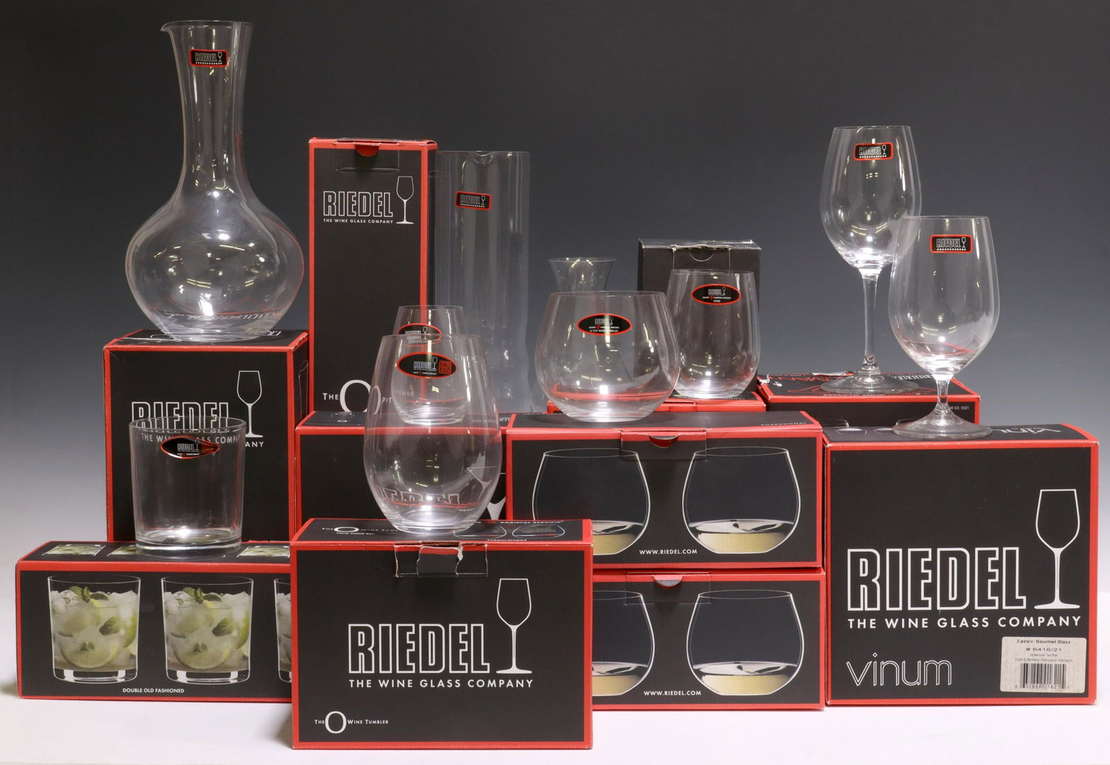 (25) RIEDEL COLORLESS GLASS STEMWARE & DECANTERS: (lot of 25) Riedel colorless glass stemware and decanters, varying patterns, all new in box, all with acid-etched maker's mark underfoot, including: (4) "Vivant" white wine glasses, approx 8.25"h, 2.2