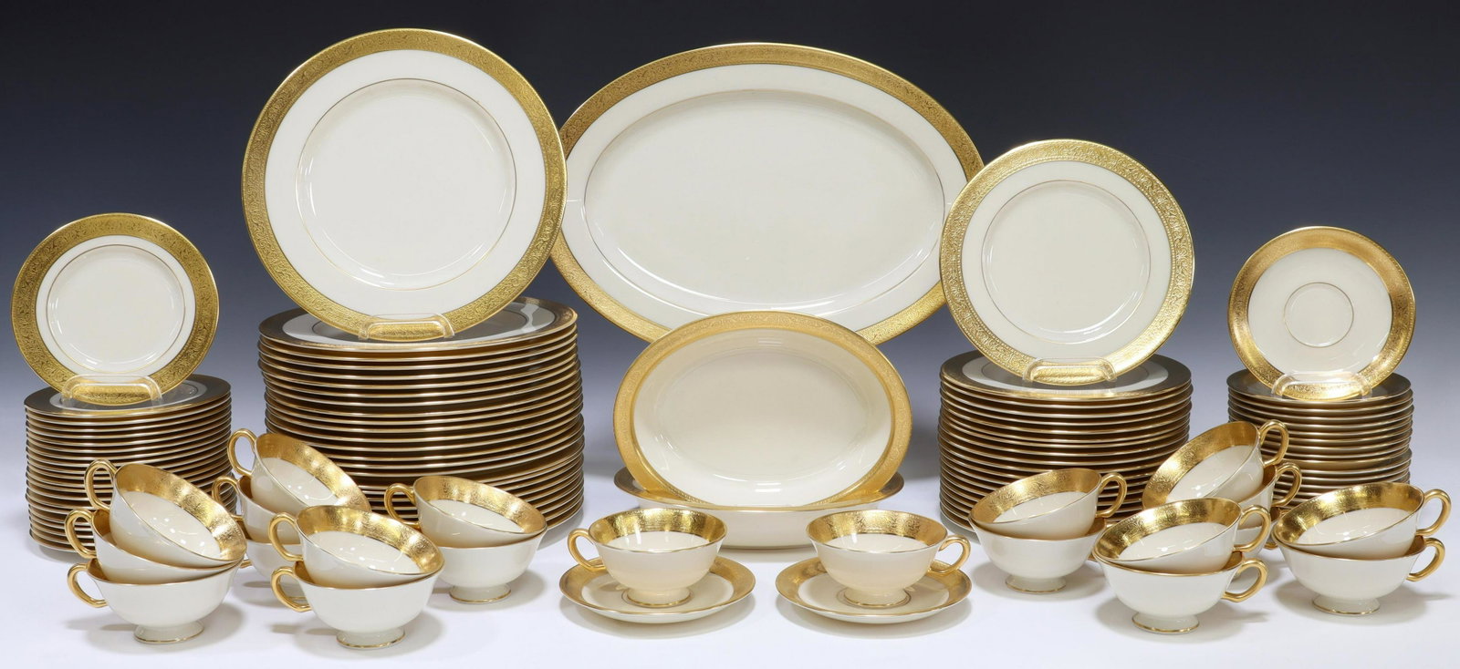 111) LENOX WESTCHESTER IVORY & GOLD DINNER SERVICE: (lot of 111) Lenox ivory bone china dinner service, in the Westchester Presidential gold pattern, having gold encrusted band, including: (25) dinner plates, approx 10.5"diam, (21) salad plates, approx