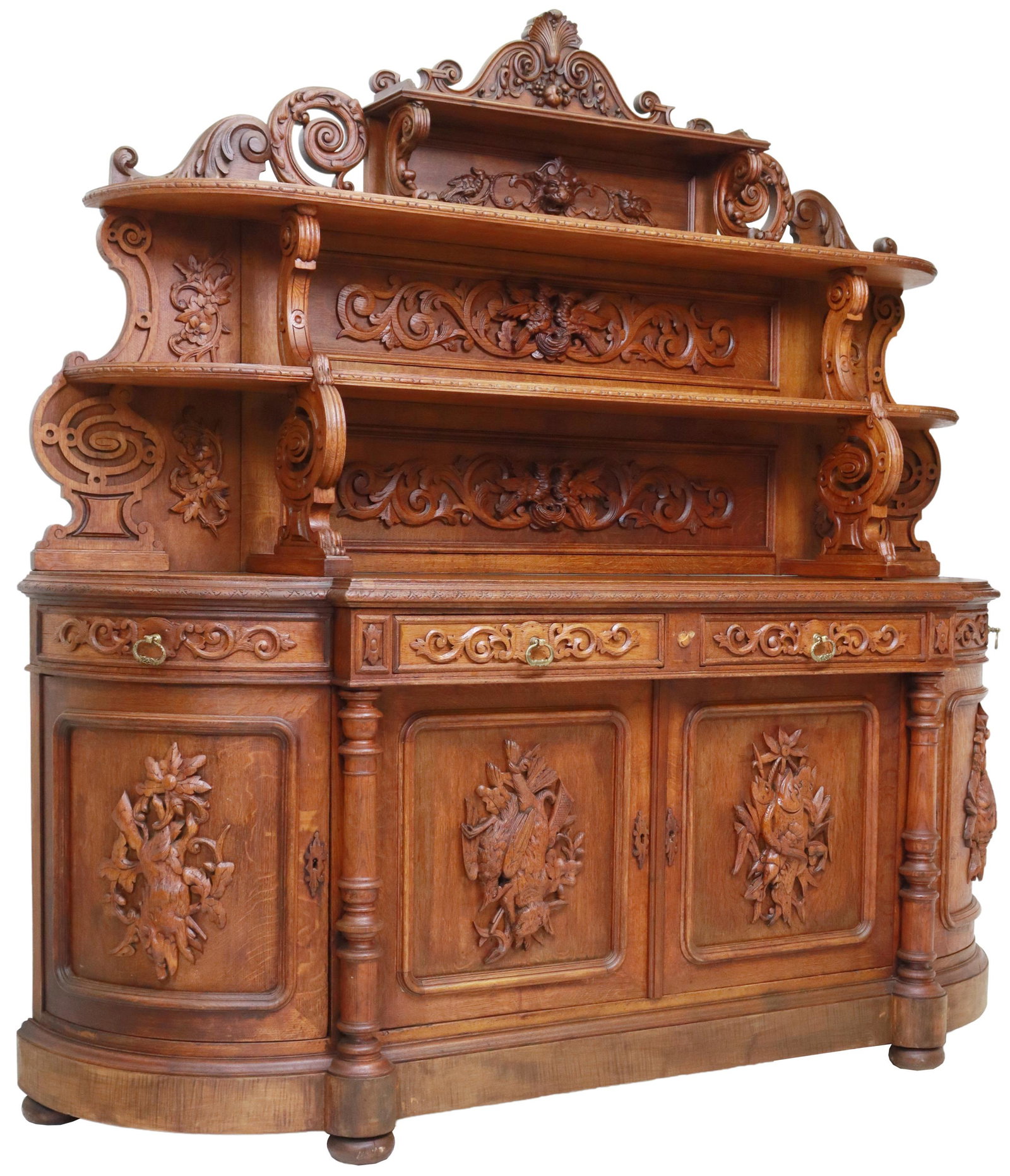 FRENCH SAINT HUBERT CARVED OAK HUNT SIDEBOARD: French Saint Hubert oak hunt sideboard, late 19th c., three tiers of open shelves, over D-shaped case, fitted with four drawers, over four cabinet doors, carved with game animals including wild boar, 