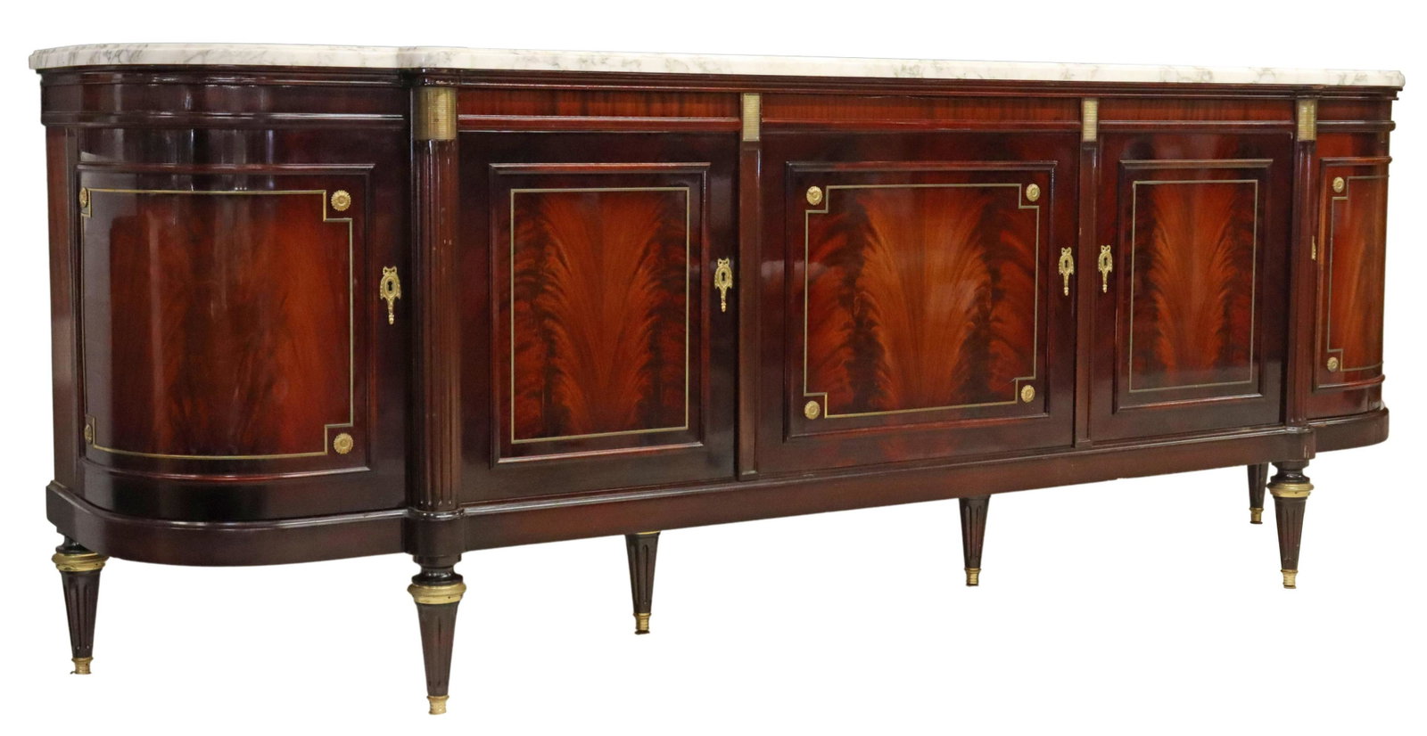 LOUIS XVI STYLE MARBLE-TOP MAHOGANY SIDEBOARD: French Louis XVI style marble-top flame mahogany sideboard, attributed to Jean-Pierre Ehalt, late 20th c., gilt metal mounts, five cabinet doors, including a bowfront door at each end, far left cabine