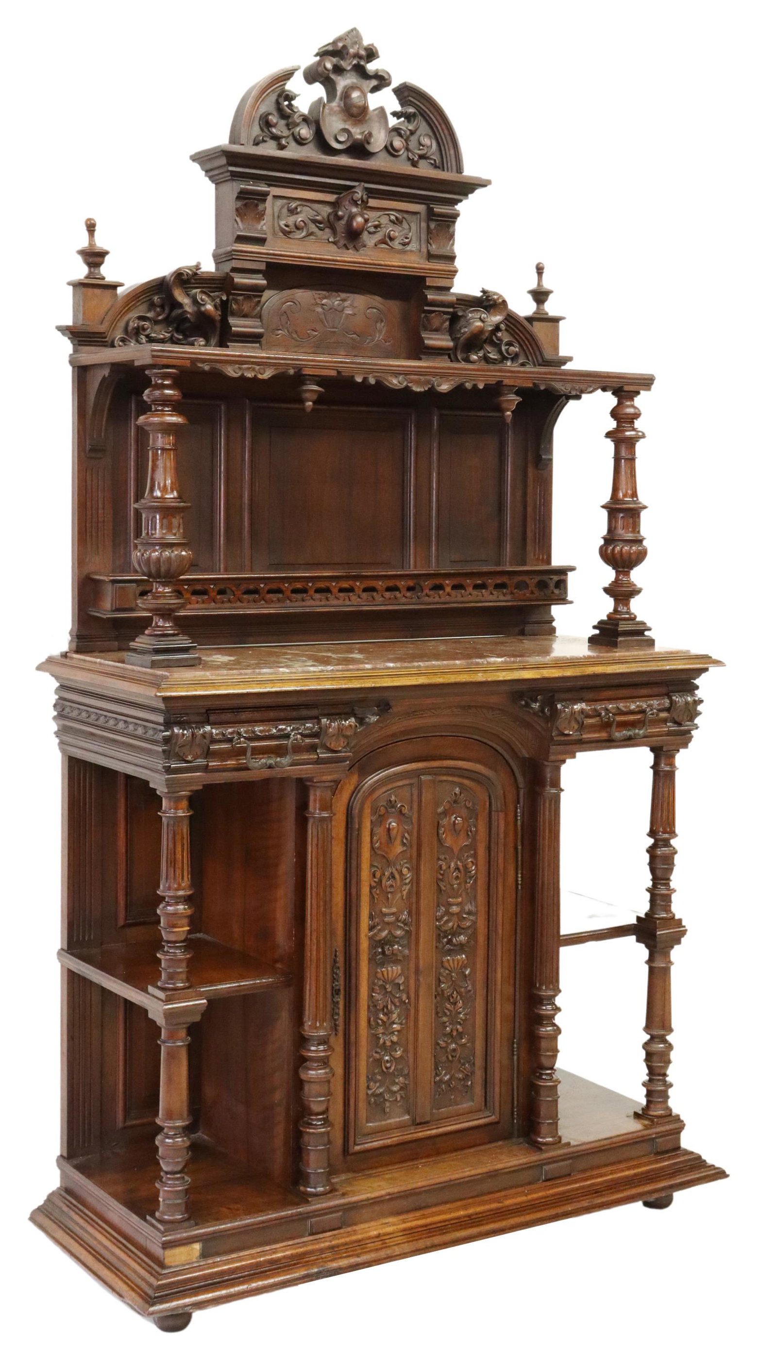 ITALIAN RENAISSANCE REVIVAL WALNUT SIDEBOARD: Italian Renaissance Revival carved walnut sideboard, 19th c., split pediment, open top shelf, over inset marble top with carved back gallery, fitted with two drawers, central cabinet, flanked by two o