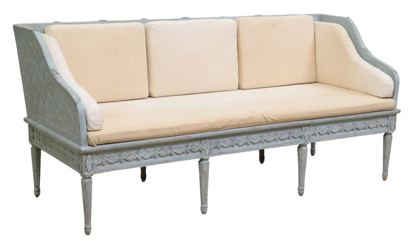 FRENCH LOUIS XVI STYLE PAINTED & CARVED SETTEE: French Louis XVI style painted wood sofa/ settee, mid 20th c., frame in a diaper pattern to sides and back, foliate carved apron, rising on fluted and tapered legs, ending on blunt arrow feet, discolo
