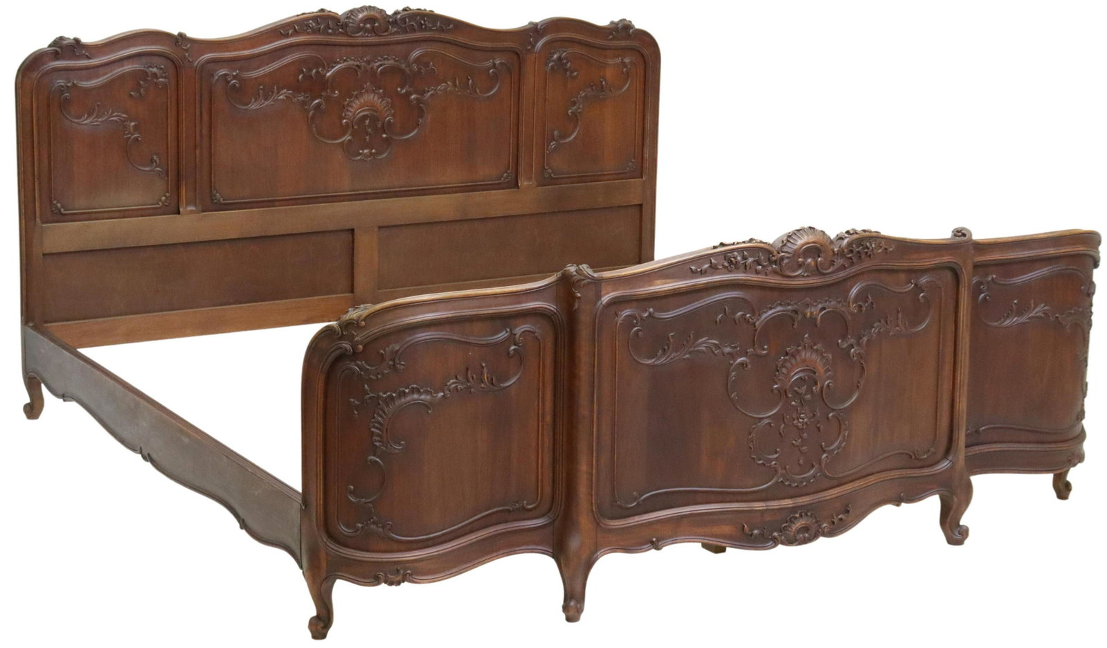 FRENCH LOUIS XV STYLE CARVED WALNUT BED: French Louis XV style walnut bed, late 19th c., carved rocaille crest, shaped head and foot boards, rising on cabriole legs, ending on whorl feet, exterior: approx 44.5"h, 86.5"l, 83"w, interior: appr
