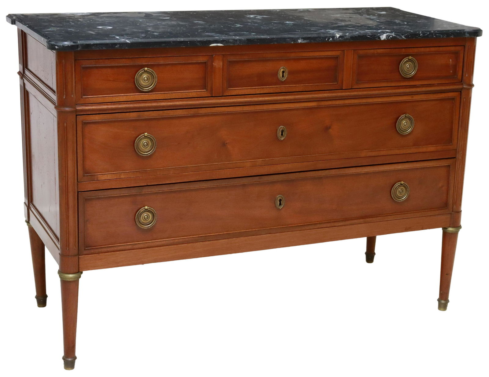 FRENCH LOUIS XVI STYLE MARBLE-TOP MAHOGANY COMMODE: French Louis XVI style mahogany commode, late 19th/ early 20th c., having marble top, over three drawers, flanked by fluted supports, rising on tapered legs, ending on capped feet, separation at side