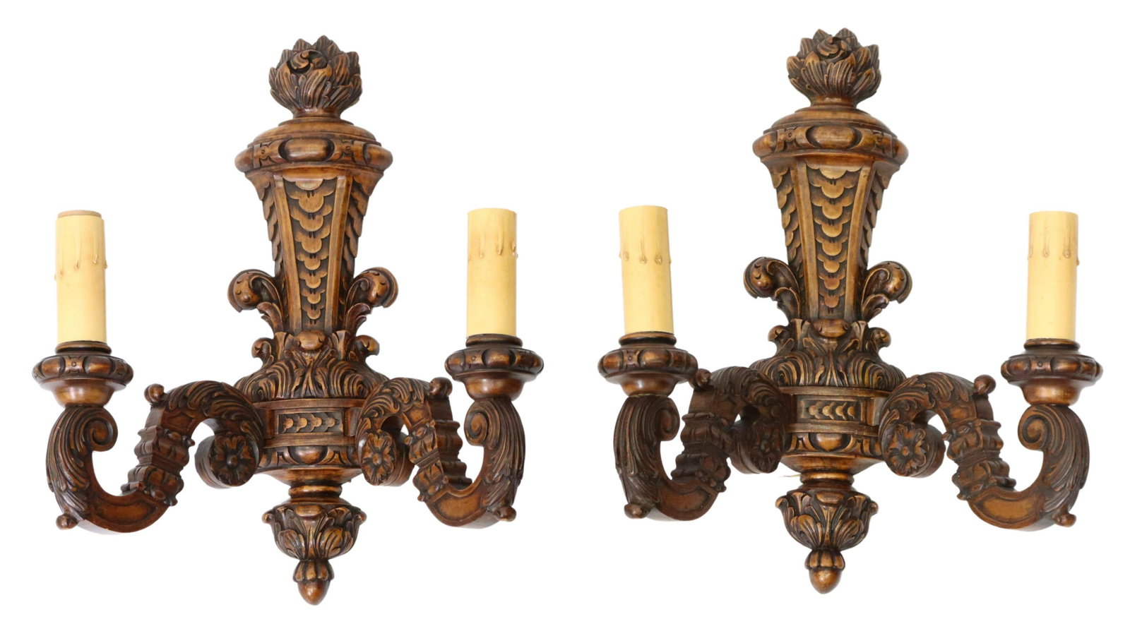 (2) CARVED WOOD FOLIATED TWO-LIGHT WALL SCONCES: (pair) Carved wood wall sconces, 20th c., flaming torch backplate, with carved running ornamentation, issuing two foliated scroll arms, terminating in faux candle covers, in need of wiring, approx 16.