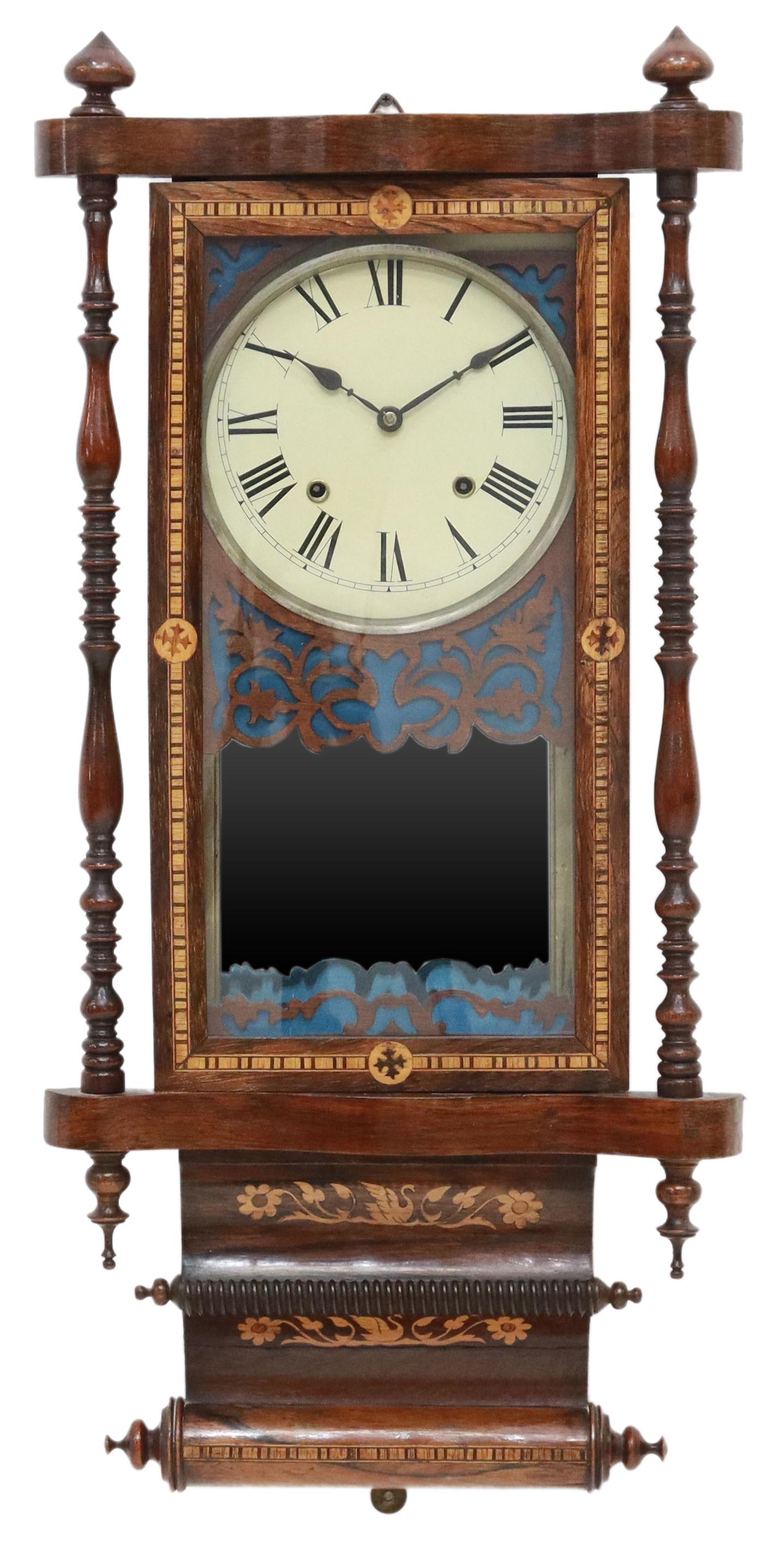 ANGLO-AMERICAN DROP DIAL WALL CLOCK, 19TH C.: Anglo-American drop dial wall clock, 19th c., rosewood case with contrasting marquetry, turned finials, side columns, metal dial with Roman numeral hour markers, time-and-strike movement, mirrored int