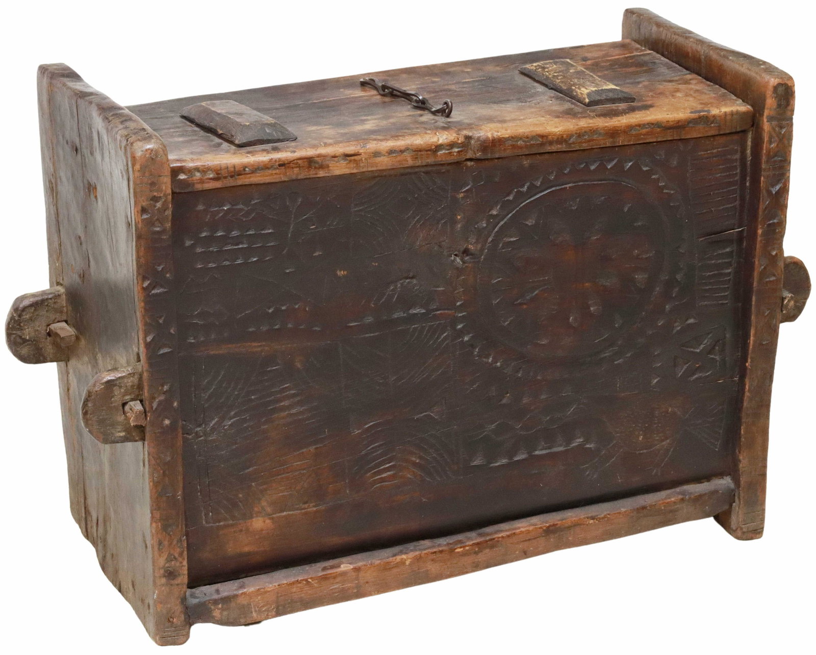 ANTIQUE CARVED WOOD COFFER OR STORAGE TRUNK: Carved wood coffer/ storage trunk, 19th c., having hinged rectangular top, front chain closure, open interior, protruding rounded handles at sides, incised geometric motifs at front face, later interi