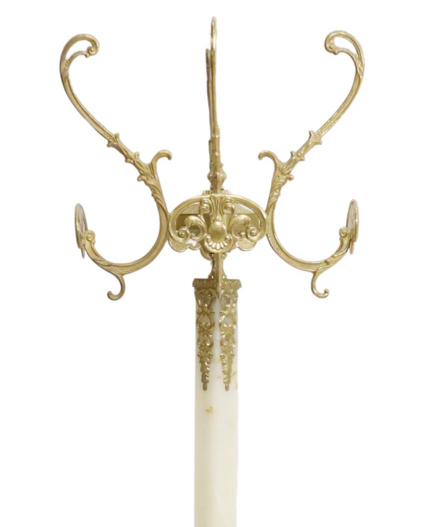 ITALIAN ONYX & GILT METAL STANDING HALL TREE: Italian onyx and gilt metal hall tree, 20th c., having four scrolling arms terminating in coat and hat hooks, over squared onyx standard, rising on figural quadripartite base, ending in paw feet, appr