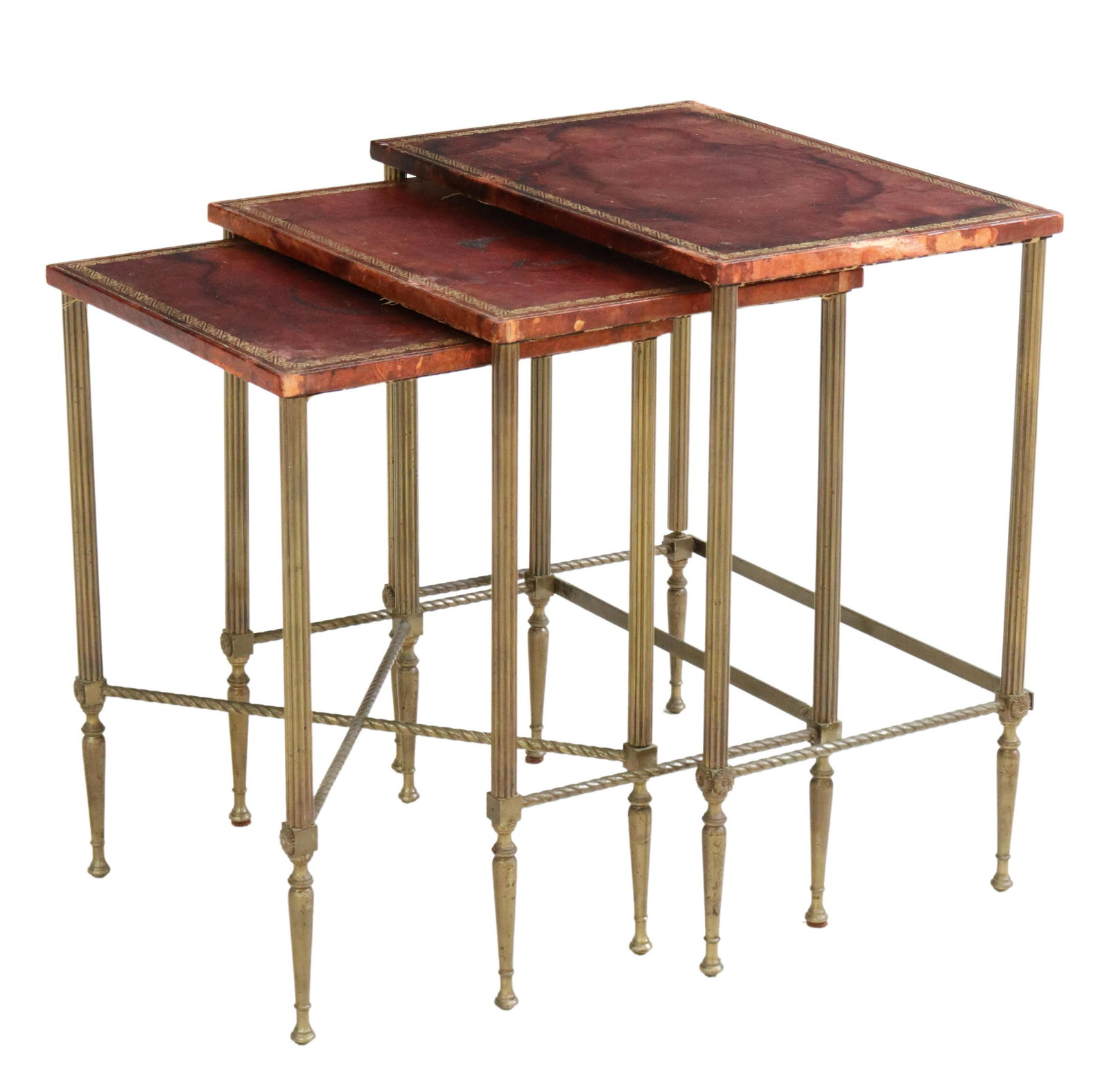 (3) FRENCH LEATHER-TOP METAL NESTING TABLES: (lot of 3) French nesting tables, 20th c., embossed leather-clad top, rising on patinated metal fluted supports, joined by stretchers, ending in tapered legs and flared feet, largest: approx 22.5"h, 2