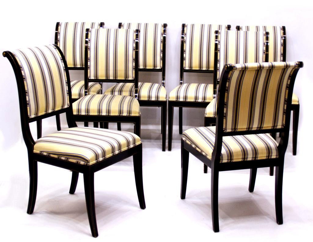 NEOCLASSICAL STYLE SLEIGH BACK DINING CHAIRS: (set of 8) Neoclassical style sleigh back dining chairs, Kindel Furniture Company, Grand Rapids, Michigan, Model No. 75-072, each black lacquer frame with gilded string border over maple, striped upho