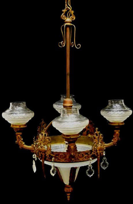 SPANISH FIVE LIGHT GILT METAL & GLASS CHANDELIER: Spanish chandelier, Barcelona, c. 1920, a circular gilt metal frame with four torch form lights alternating between decorative pendants with floral decoration, a central drop white shade with a single