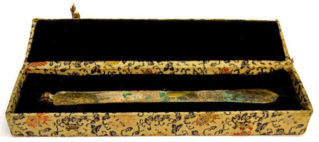 CHINESE GILT CEREMONIAL SWORD BLADE OR FAN HANDLE: Chinese gilt ceremonial blade or fan handle with much oxidation, possibly Han dynasty, presented in a worn box with notation reading ''Han dynasty beautiful metal fan handle', handle: 8.75"l, boxed: 1