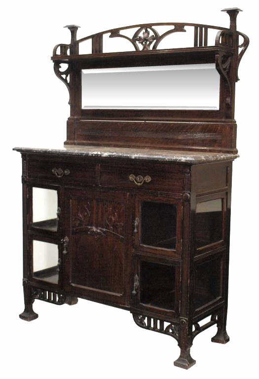 SPANISH ART NOUVEAU MARBLE TOP SERVER SIDEBOARD: Spanish Art Nouveau carved oak server sideboard, Barcelona, c. 1900, a mirrored top with floral and curving wood decoration over marble, two silver drawers, a lower center door flanked by four glass f