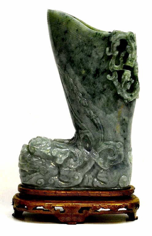 CHINESE TRANSLUCENT JADEITE DRAGON CARVED VESSEL: Chinese translucent jadeite libation vessel in the shape of a boot, carved and incised to the front with the head of a fu-lion with a pair of chilong dragons in high relief featured on the reverse, th