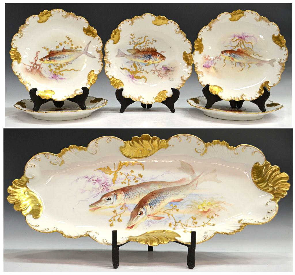 ANTIQUE HAND PAINTED LIMOGES PORCELAIN FISH SET: (set of 6) Hand painted porcelain fish set, Limoges, France, the scalloped rim of each with heavy gilding centering raised gilt seaweed accents and varied fish, on a white ground, blue mark indicating