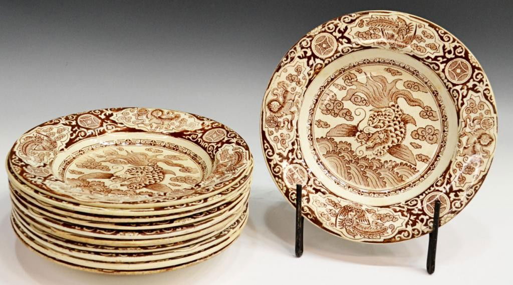 J & MPB & CO LTD BROWN DRAGON TRANSFERWARE BOWLS: (set of 11) J & M.P.B & Co. Ltd., Glasgow, brown transfer decorated bowls in an Asian pattern, the rim reserved with stylized design and foo lions, well centering a fish form dragon amid cloud scroll,