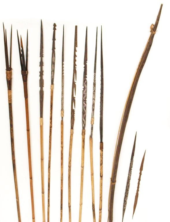 PRIMITIVE INDONESIAN HARDWOOD & BAMBOO SPEARS: (lot of 11) Primitive Indonesian spears, the points hand carved hardwood, most with barbs, mounted on bamboo shafts: (2) triple spear points, likely for fishing; (7) single spear points, most with car