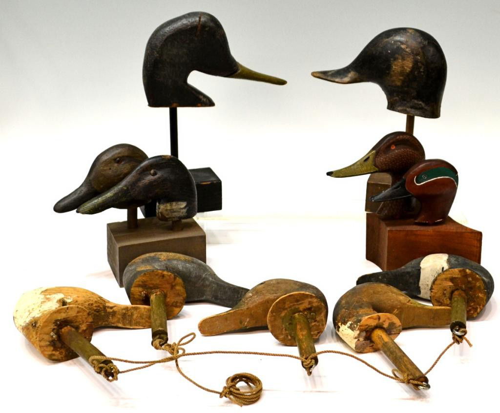 (11) WOOD DUCK HEADS FROM VINTAGE DECOYS: (lot of 11) Vintage hand carved wood duck heads, Northeast United States, removed from full body decoys, worn paint, several with glass eyes, six mounted on wood stands, largest, 10.25"h, 7.75"w, 2.5/