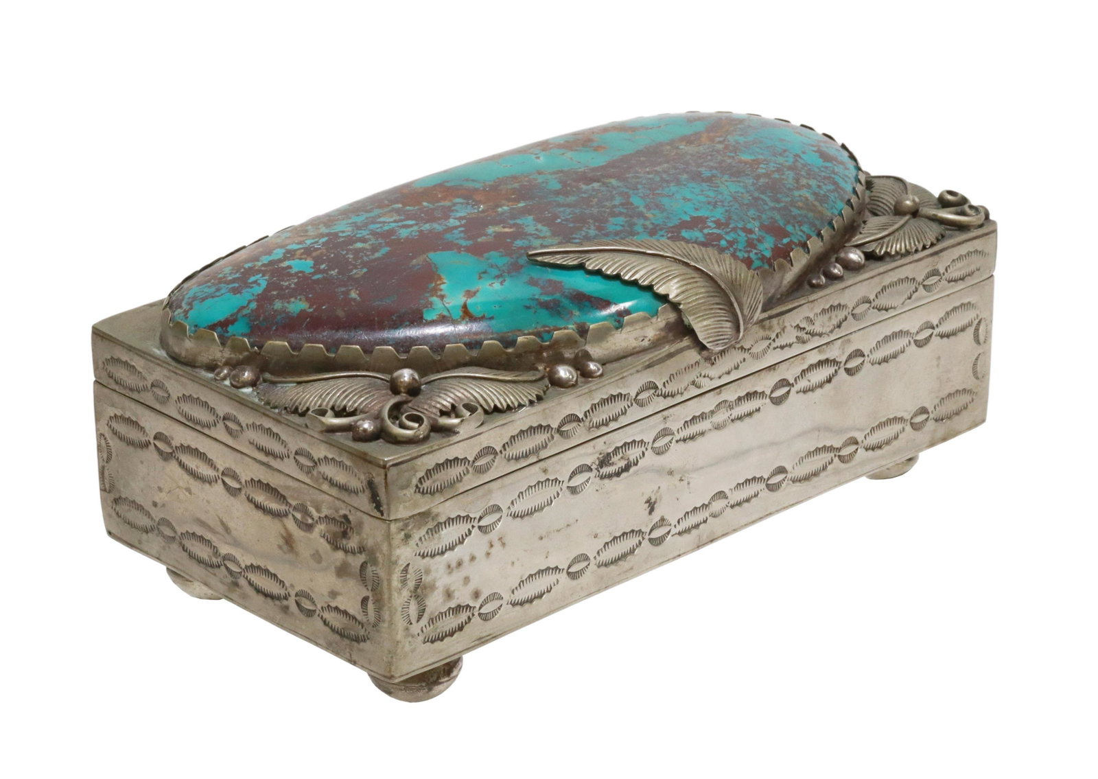 NATIVE AMERICAN NAVAJO TURQUOISE-MOUNTED TABLE BOX: Native American silver-tone metal (possibly nickel) table box, Navajo/ Dine, hinged lid mounted with large turquoise plaque, framed by applied feathers, lined interior, body with stamped designs, risi