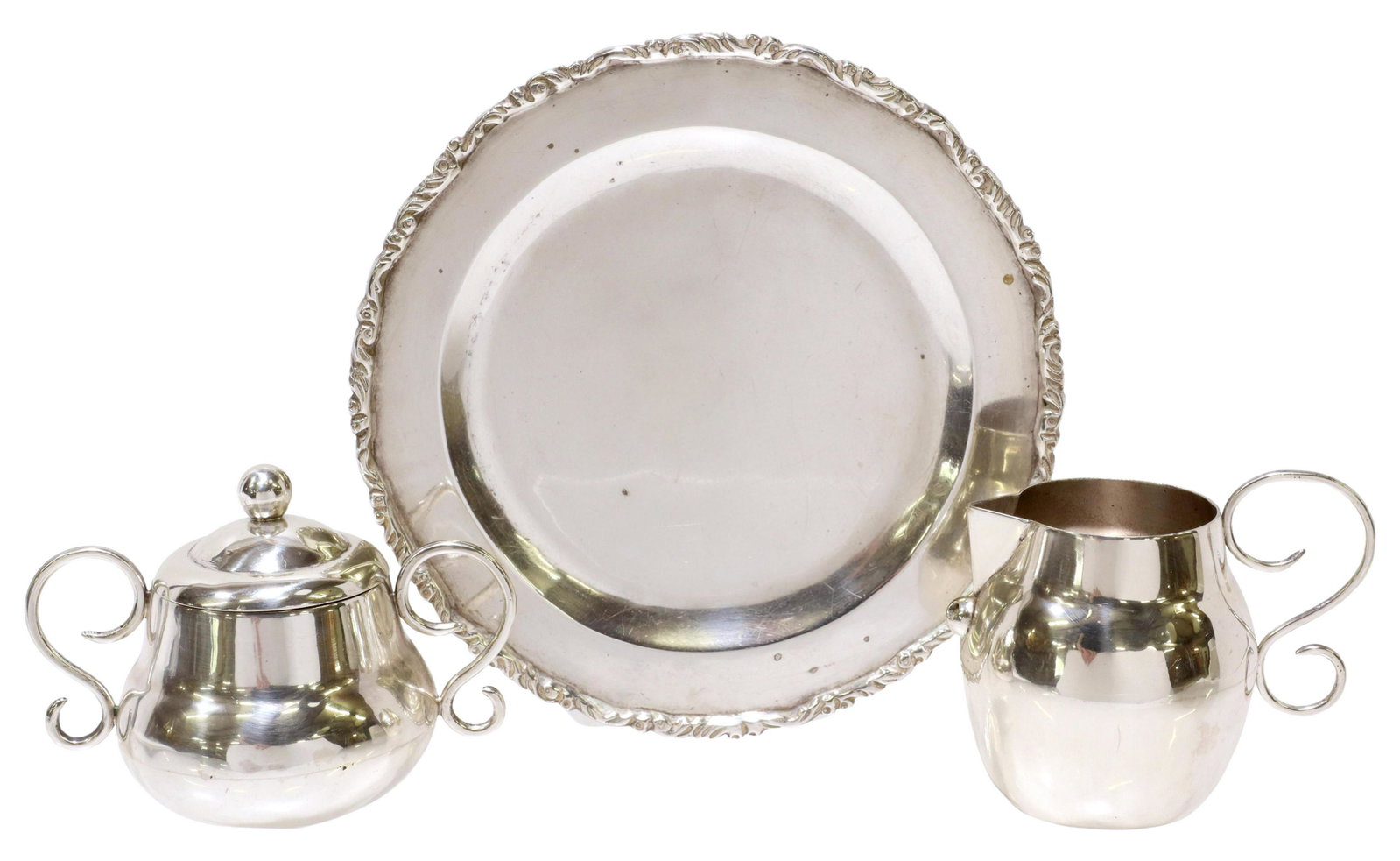 (3) STERLING PLATE, CREAMER & SUGAR BOWL, MEXICO: (lot of 3) Sterling silver tableware, Mexico, including: (1) plate, approx 7 1/8"diam, (2 piece) creamer and sugar bowl, stamped Taxco 980 underfoot, approx 3.5"h; 19.03ozt total **Provenance: From th