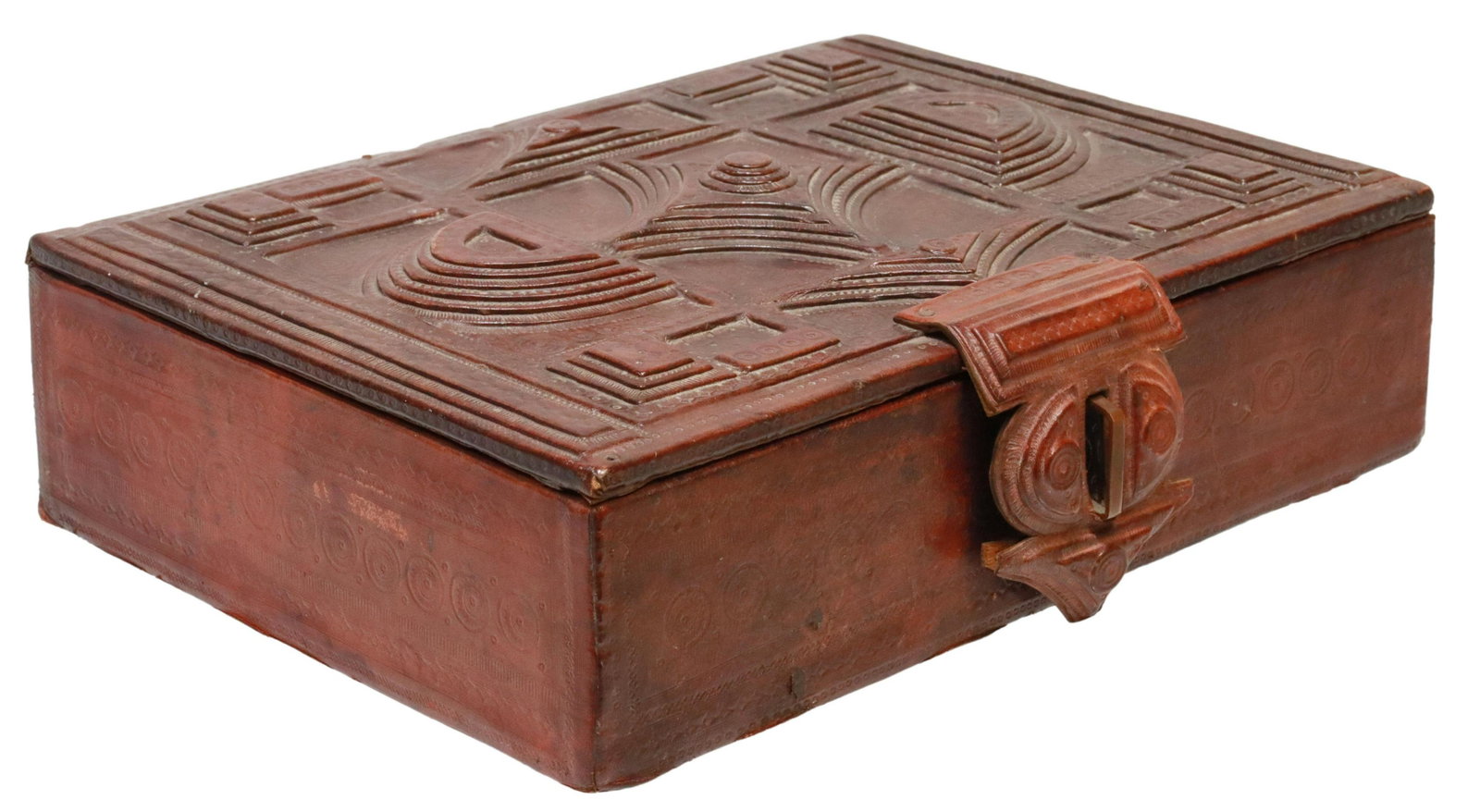 TOOLED LEATHER-CLAD BOX WITH GEOMETRIC DESIGNS: Tooled leather-clad box, hinged lid with tooled geometric designs in relief, over shaped leather clasp, opening to leather clad interior, approx 3 1/8"h, 11.5"w, 8.5"d, 3lbs Start Price: $60.00